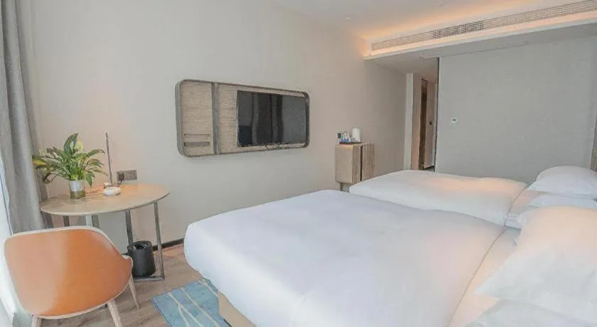 Bed in Echarm Hotel Zigong Machishui Wanda Plaza