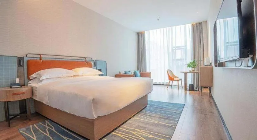 Bed in Echarm Hotel Zigong Machishui Wanda Plaza