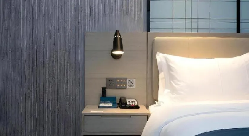 Bed in Echarm Hotel Wuhan Gaotie Jianshe 2nd Road Metro Exit