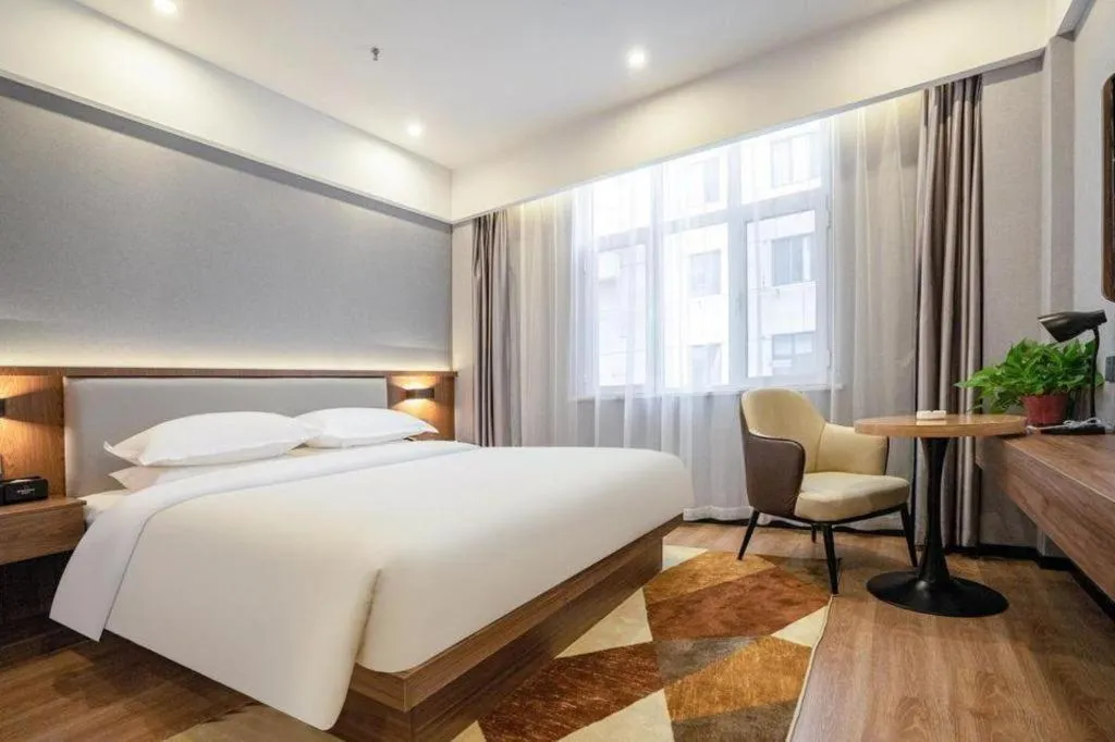 Bed in Borrman Hotel Zoucheng Huamaowan Mall