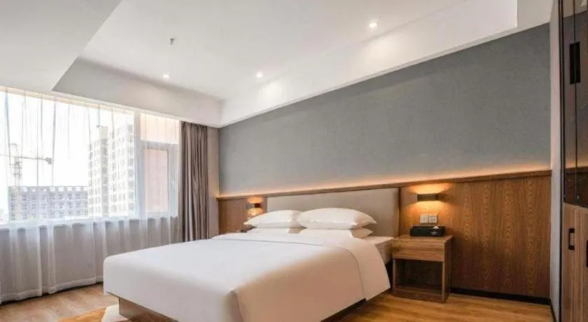 Bed in Borrman Hotel Zoucheng Huamaowan Mall