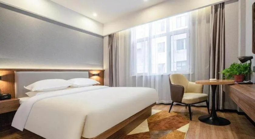 Bed in Borrman Hotel Zoucheng Huamaowan Mall