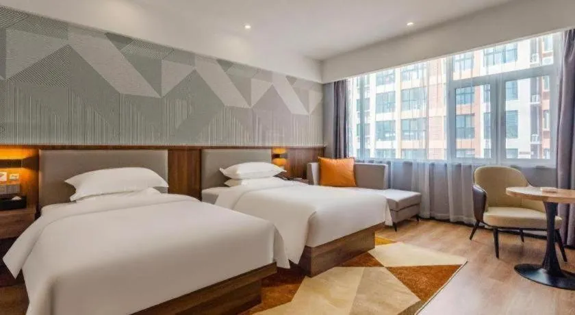 Bed in Borrman Hotel Zoucheng Huamaowan Mall