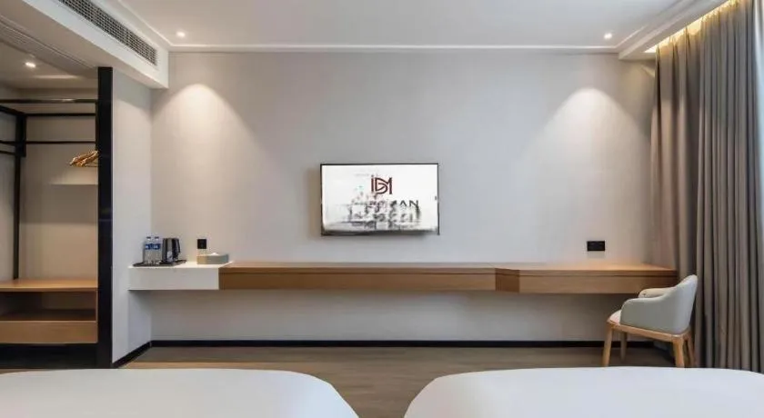 Bed in Borrman Hotel Nanning Anji Passenger Station Xijin Metro Station