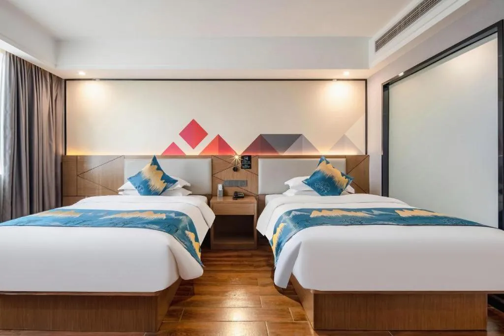 Bed in Borrman Hotel Nanning Anji Passenger Station Xijin Metro Station