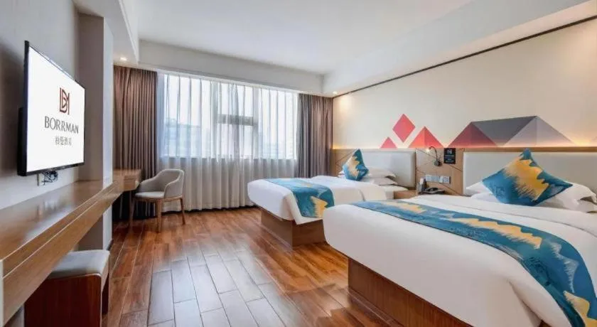 Bed in Borrman Hotel Nanning Anji Passenger Station Xijin Metro Station