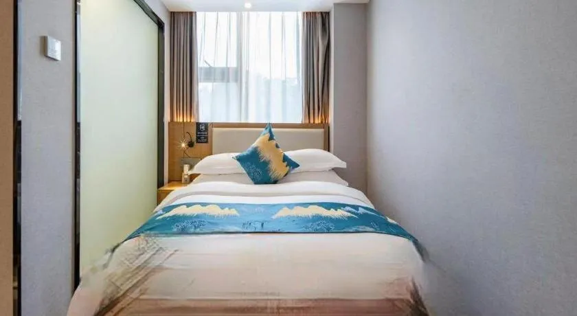 Bed in Borrman Hotel Nanning Anji Passenger Station Xijin Metro Station