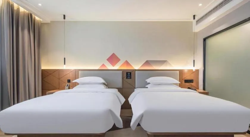 Bed in Borrman Hotel Nanning Anji Passenger Station Xijin Metro Station