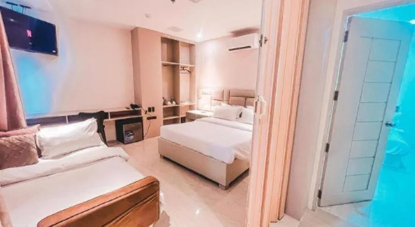 Bed in LAVERO SUITES