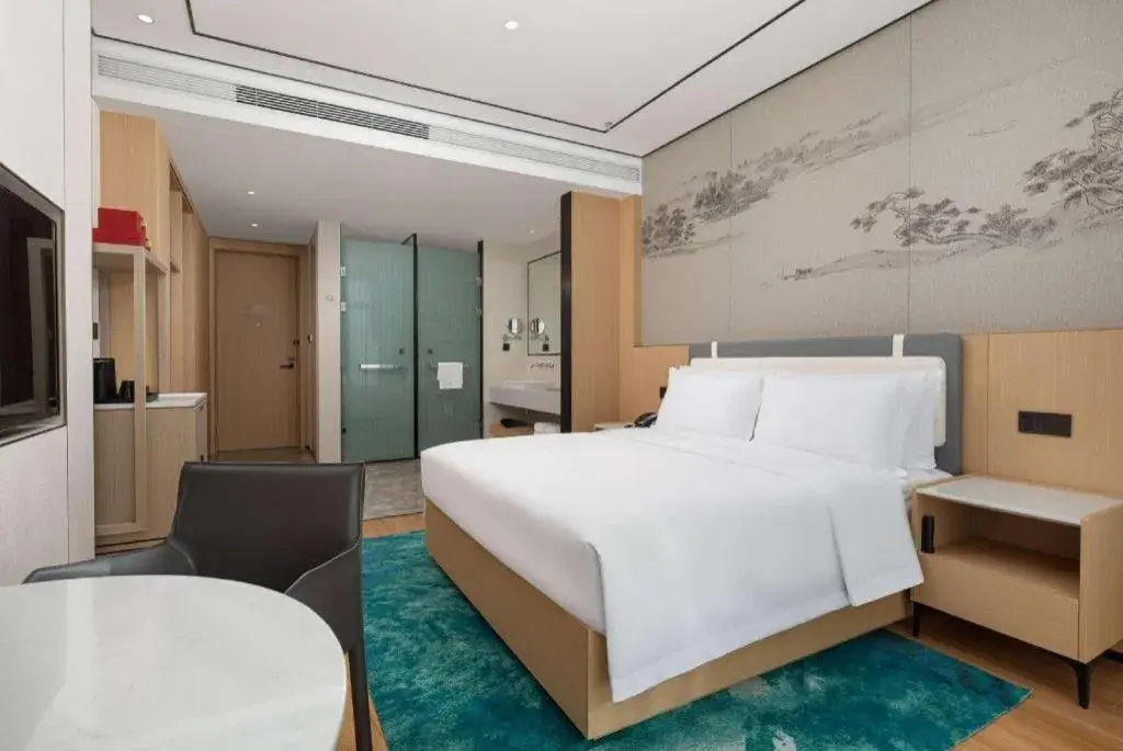 Bed in Ramada Encore by Wyndham Jinan Shanghe Bed in Ramada Encore by Wyndham Jinan Shanghe