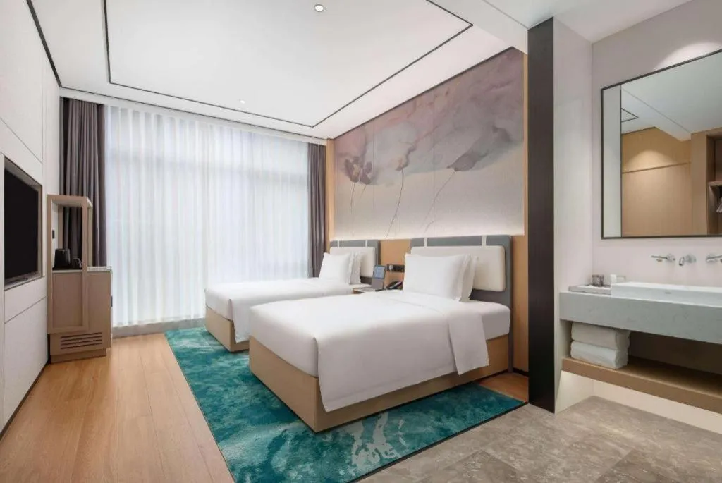 Bed in Ramada Encore by Wyndham Jinan Shanghe