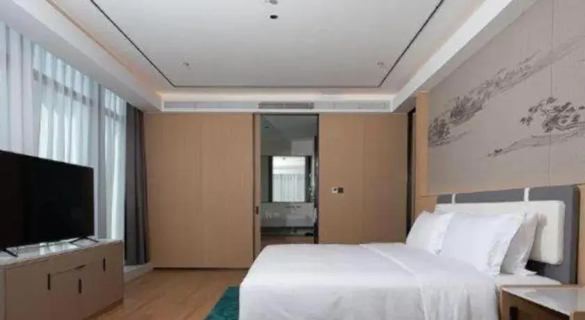 Bed in Ramada Encore by Wyndham Jinan Shanghe Bed in Ramada Encore by Wyndham Jinan Shanghe