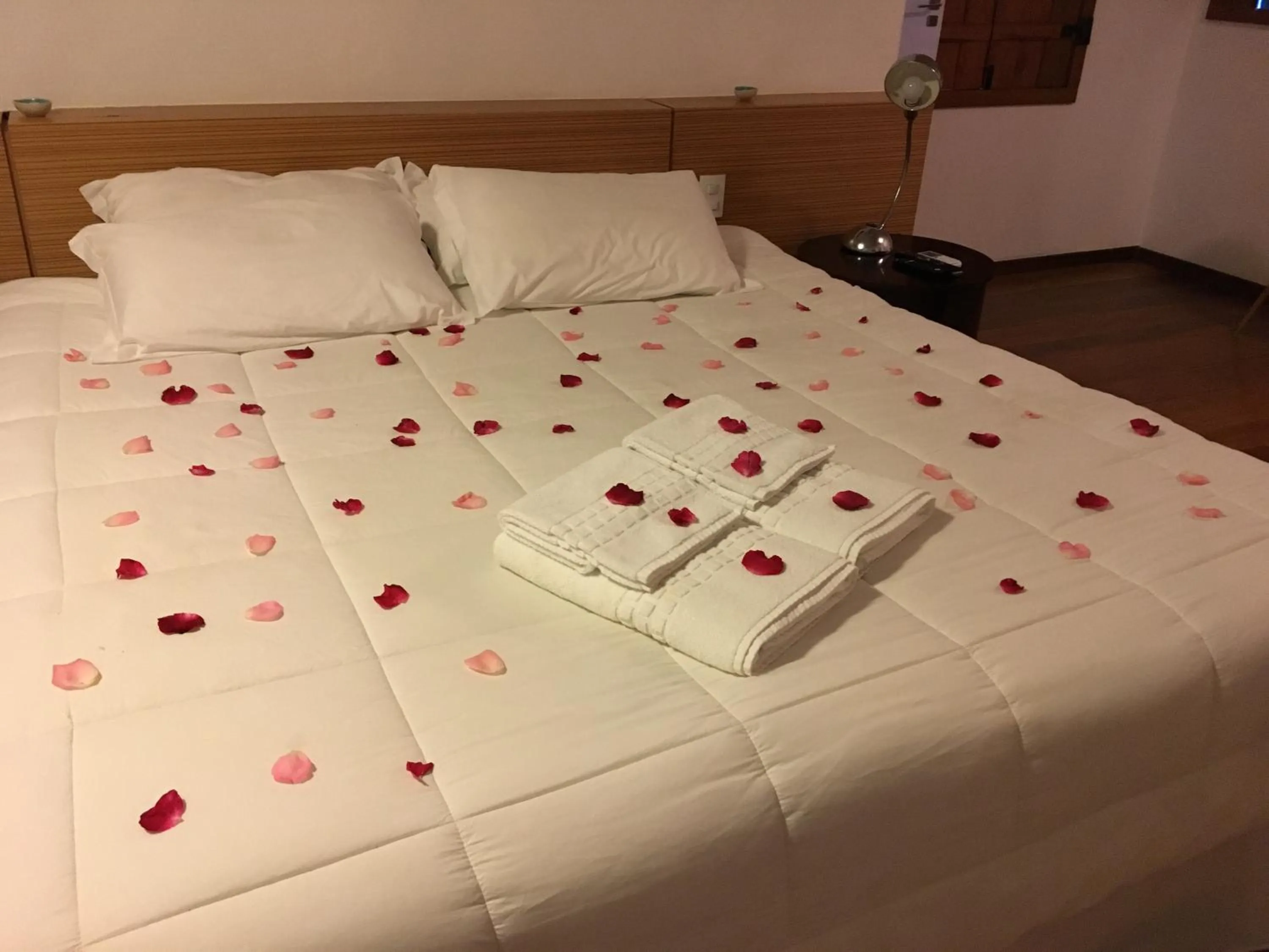 Bed in Pousada Casa das Fontes