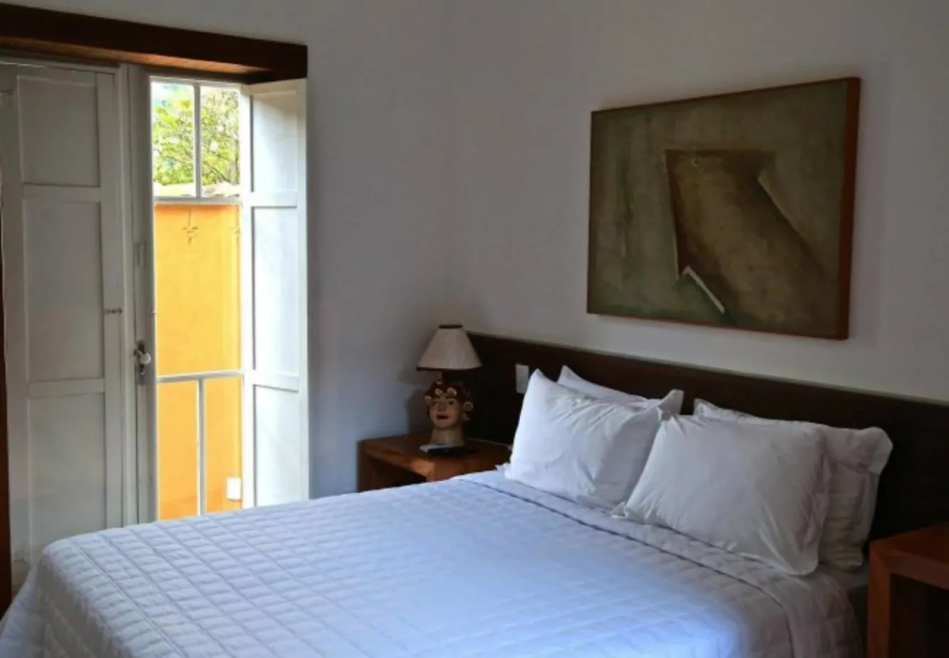 Bed in Pousada Casa das Fontes