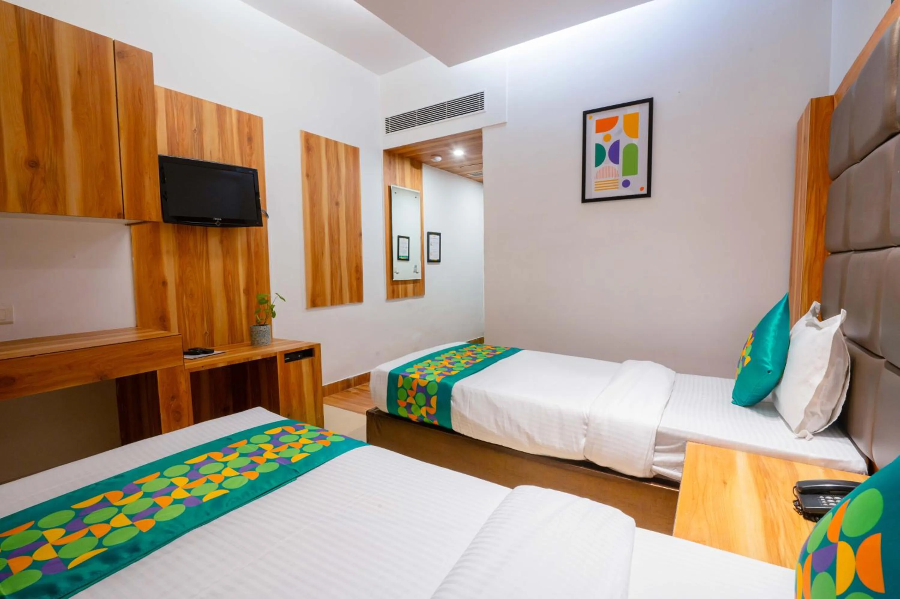 Bedroom, Bed in Treebo Twin Tree