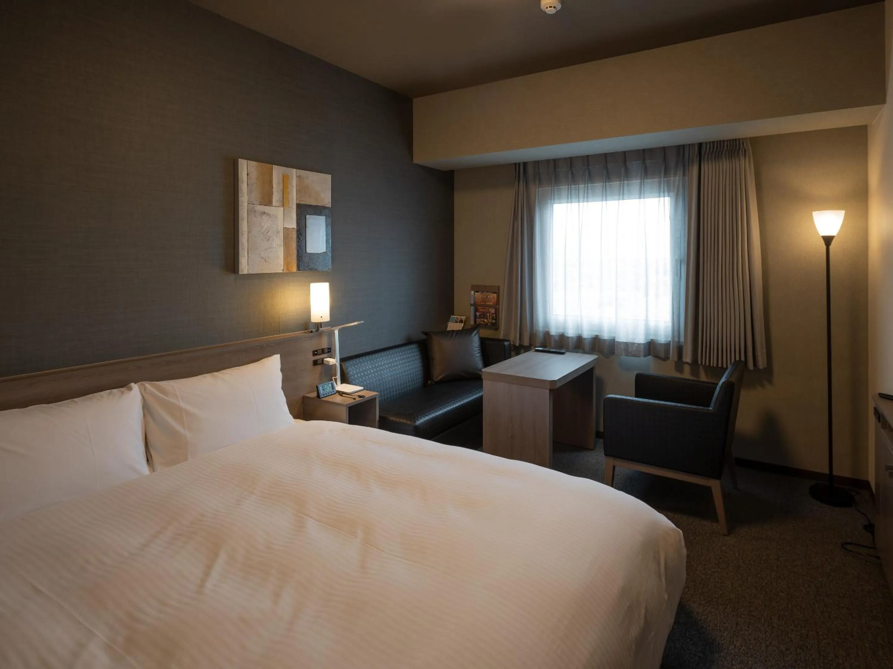 Photo of the whole room, Bed in Hotel Route Inn Grand Wakayama Eki Higashiguchi