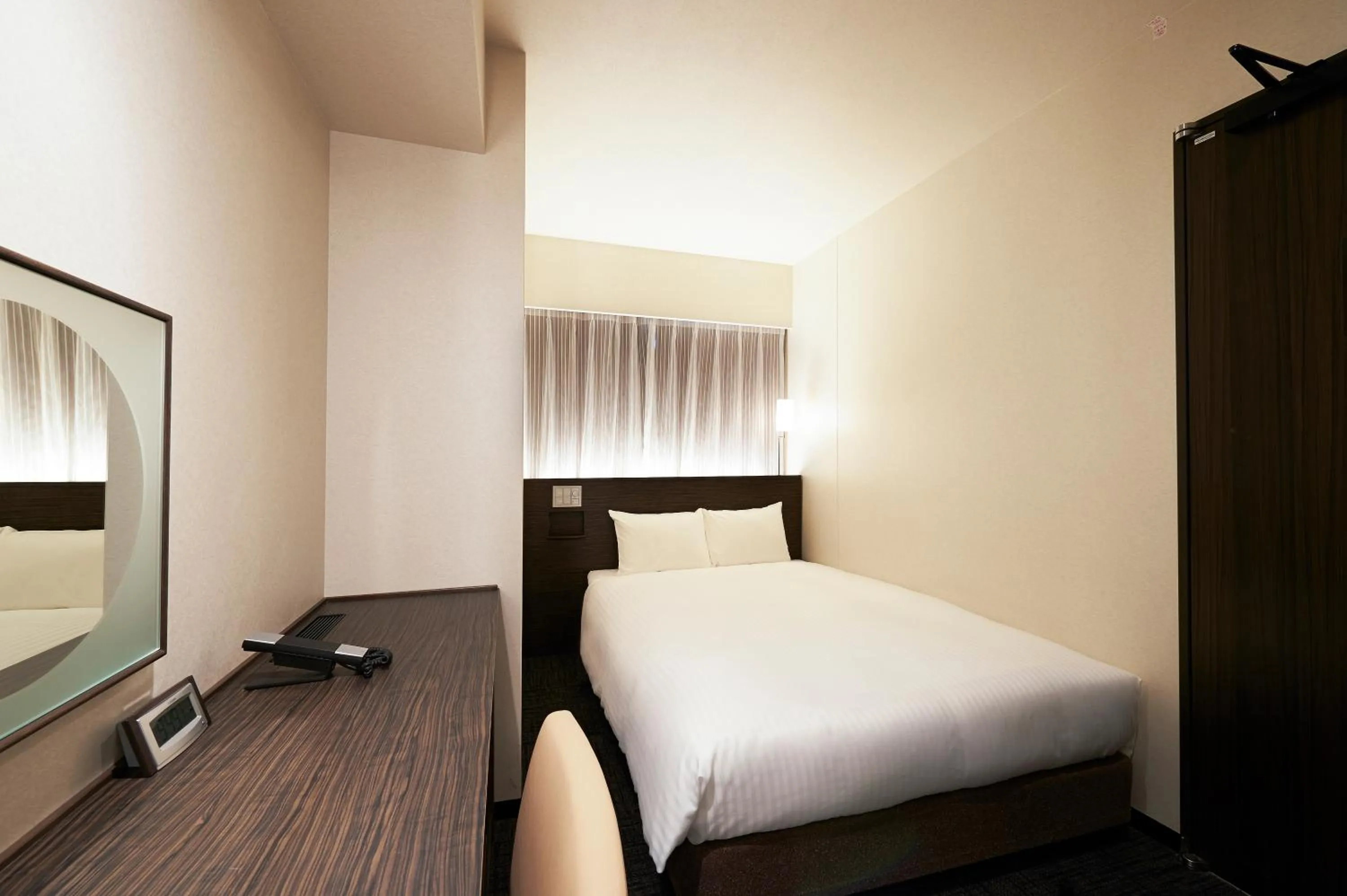 Bed in Sotetsu Fresa Inn Ochanomizu Jimbocho