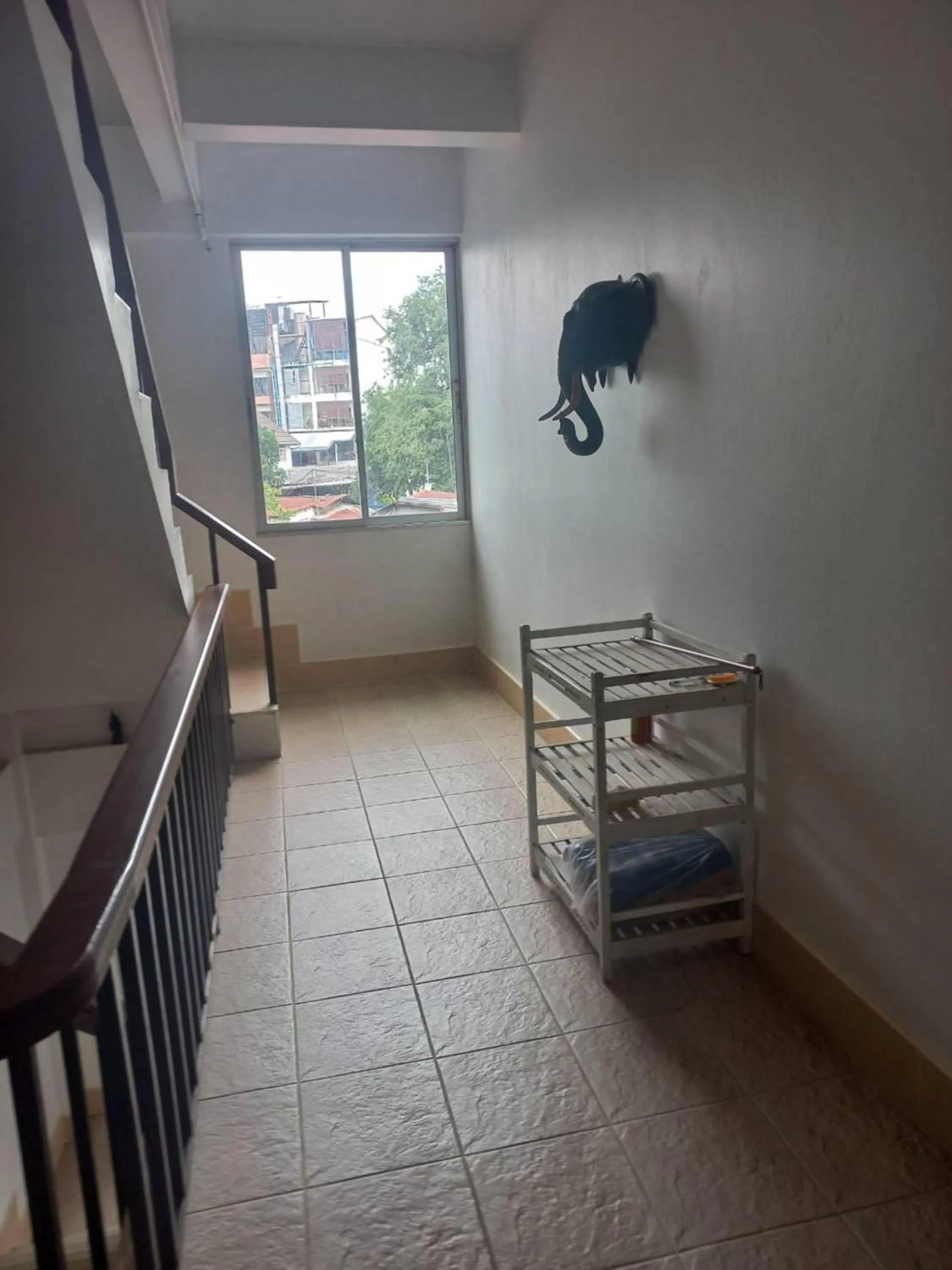 Bedroom in OYO 75474 Funkey Fulung Andy & Tan Guest House