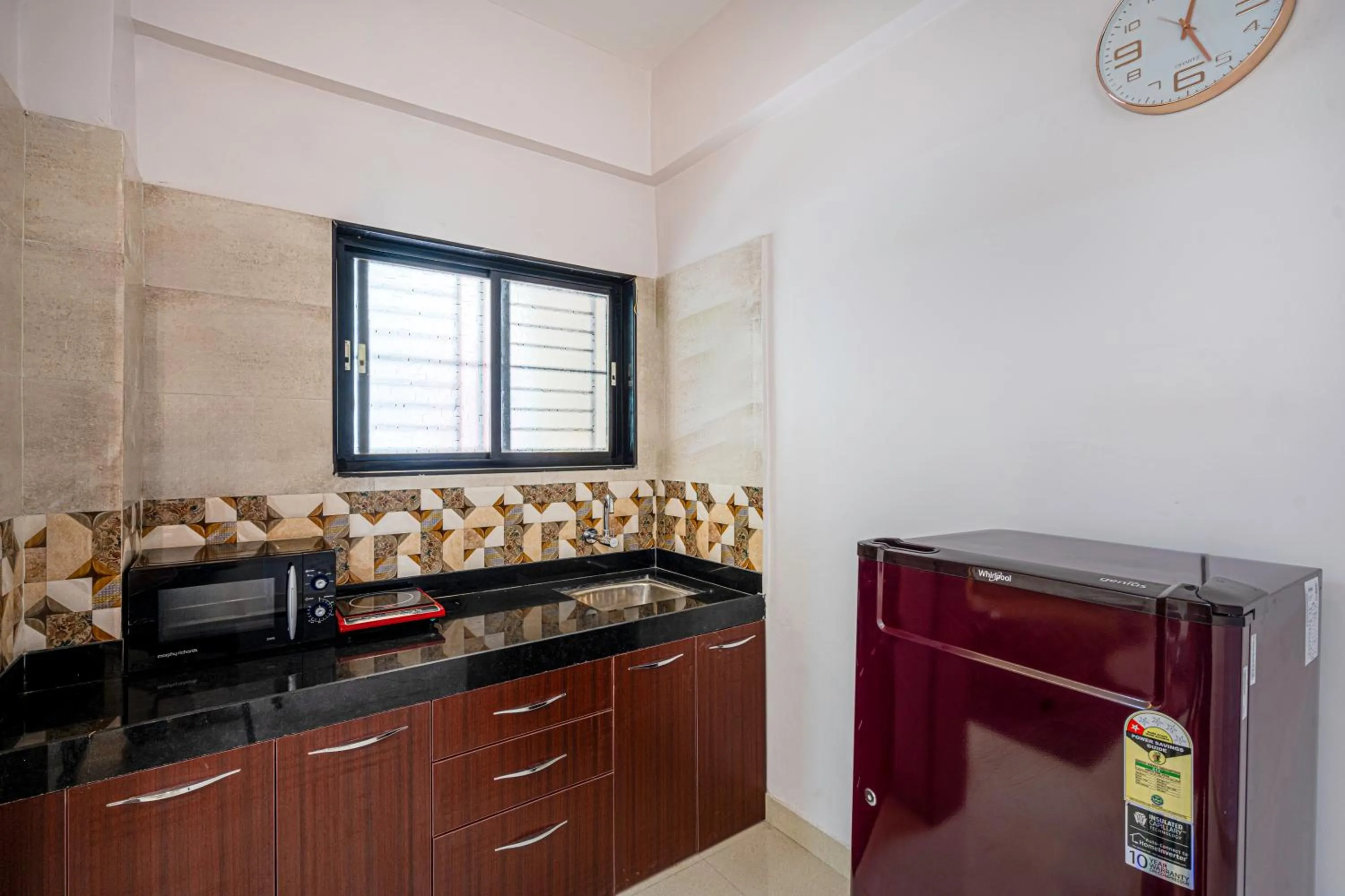 Kitchen or kitchenette in StayBird - Divine Suites, Business Hotel, Kharadi