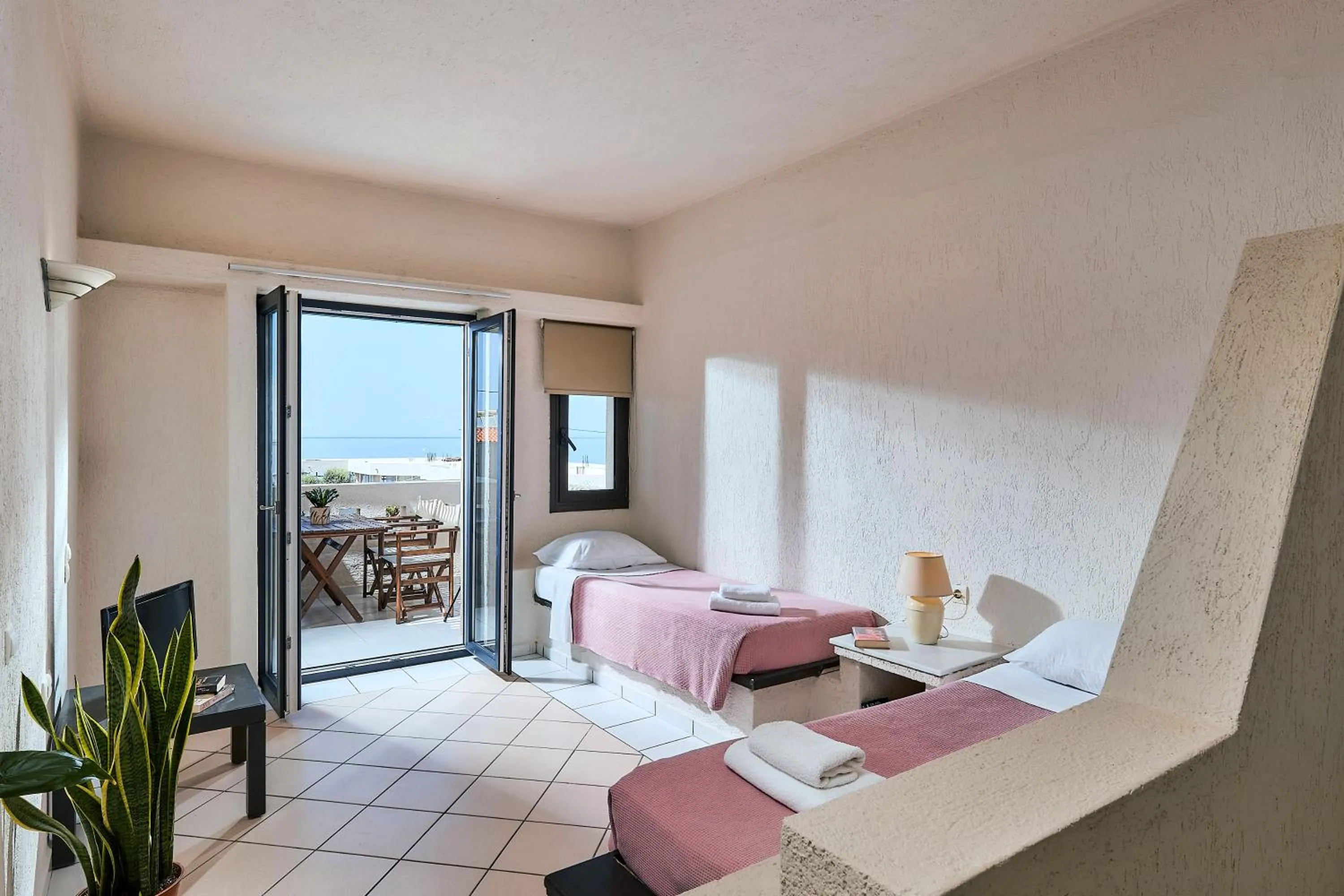 Bed in Creteco Hotel & Suites