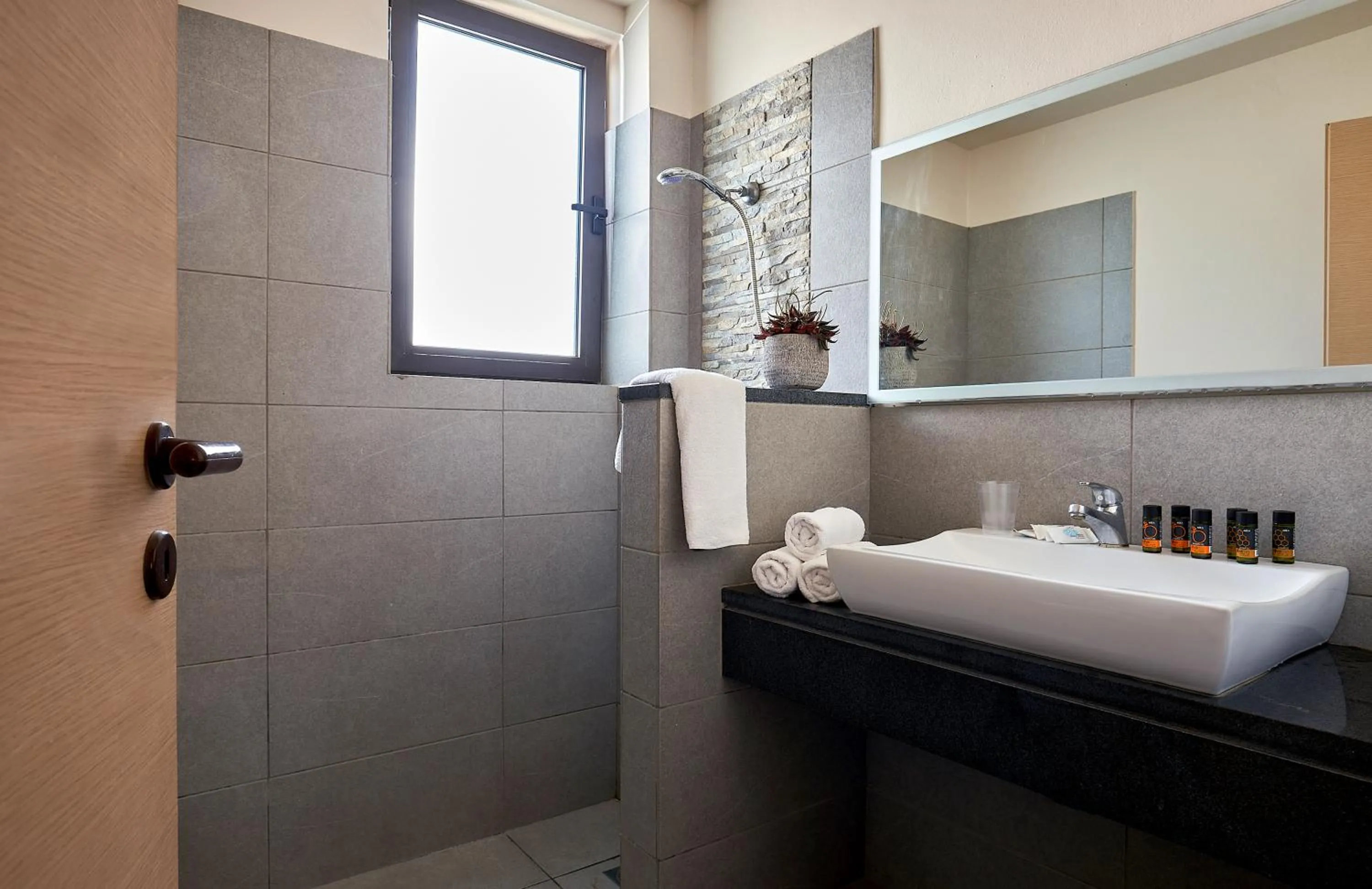 Bathroom in Creteco Hotel & Suites