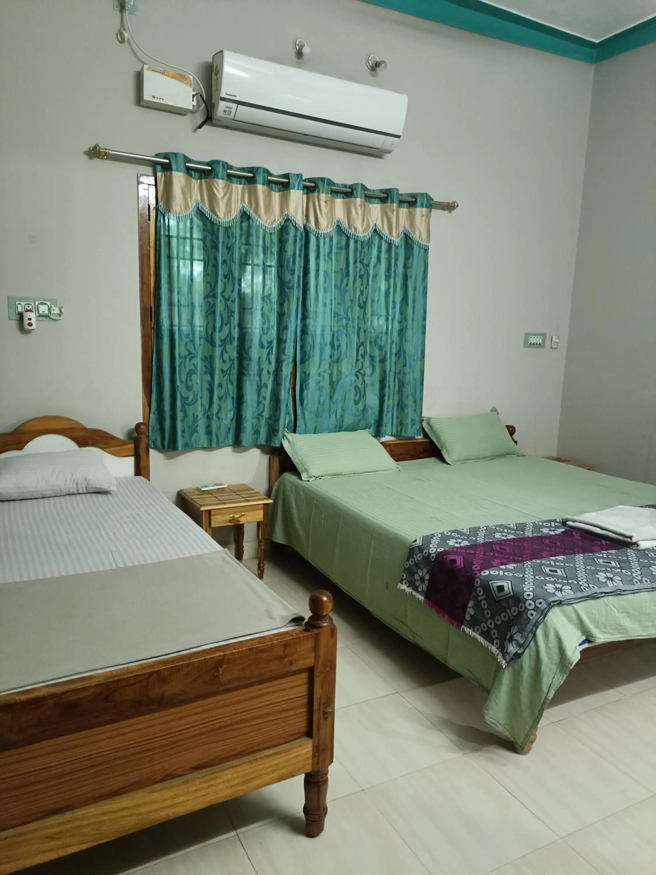 Bed in Rainbow Guest House