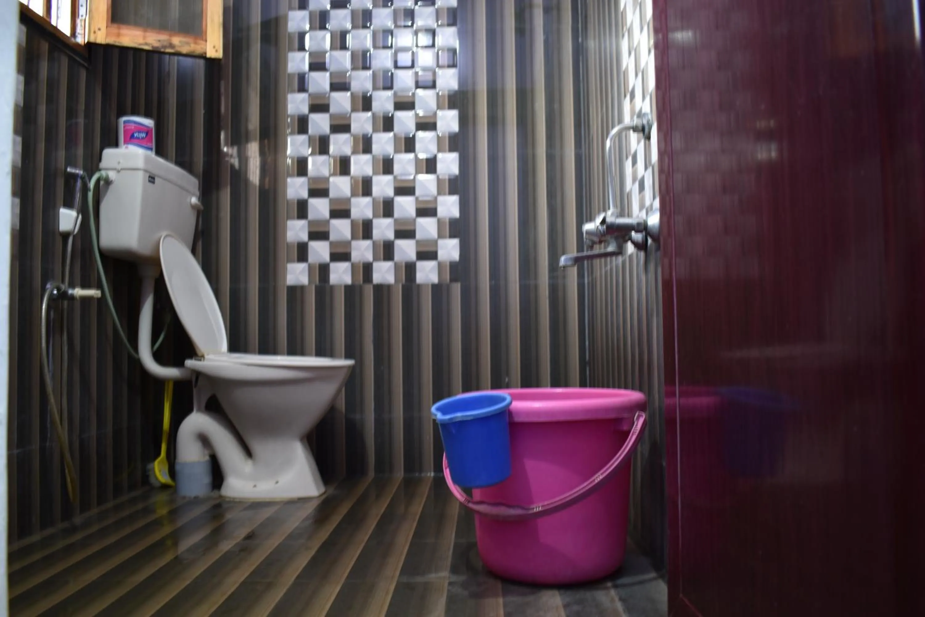 Toilet in Rainbow Guest House