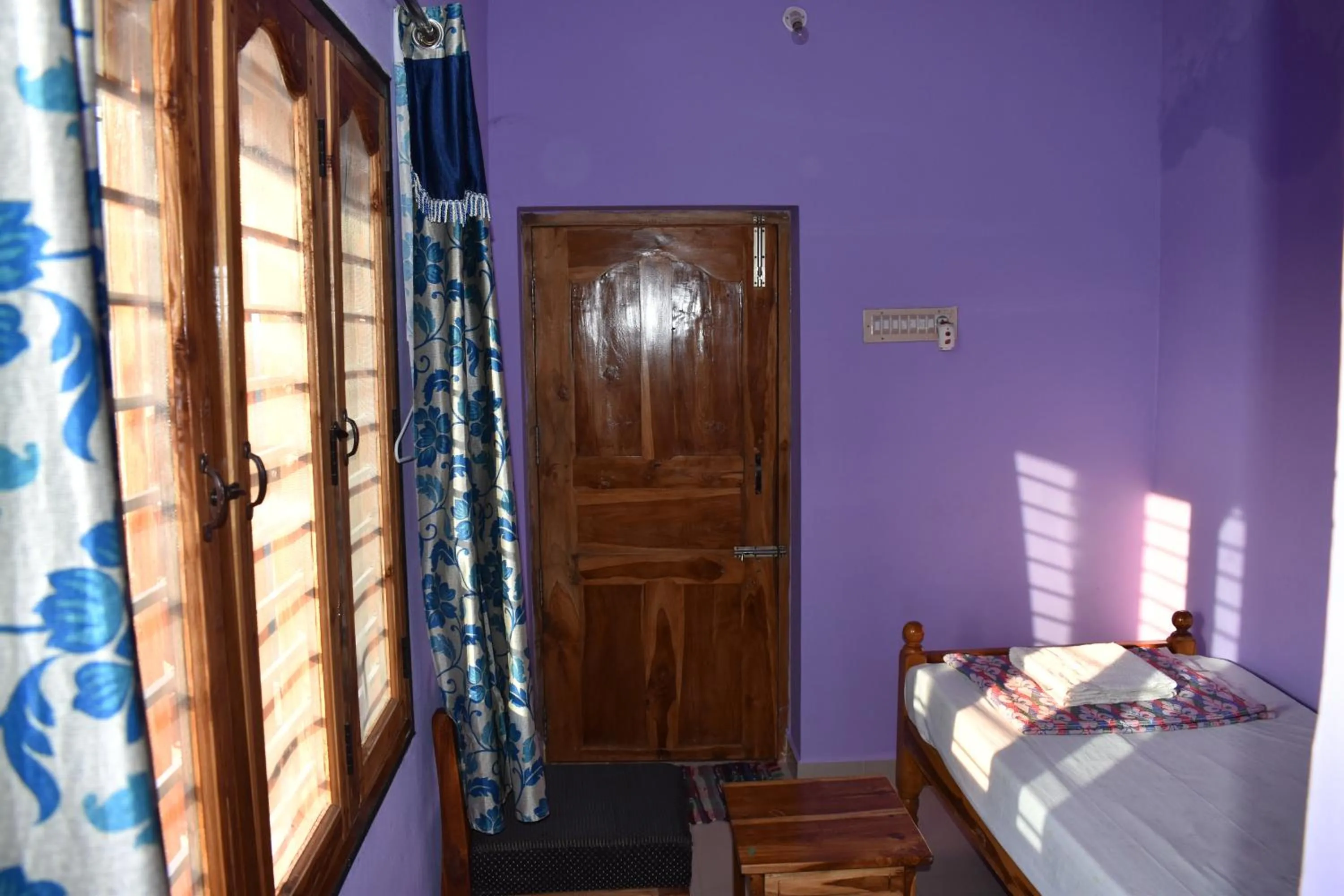 Bed in Rainbow Guest House