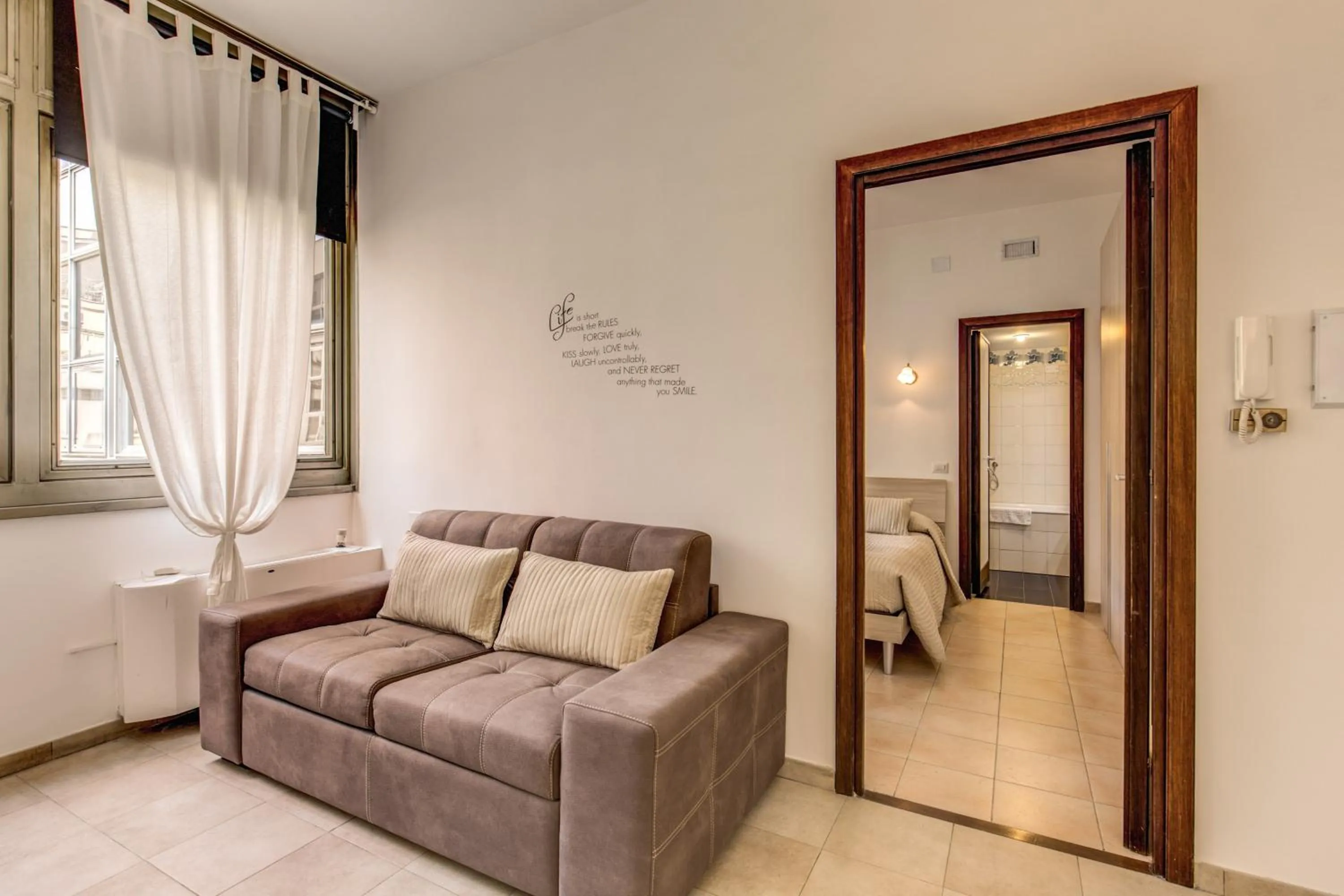 Living room, Bed in M&L Apartments - Ardesia Colosseo