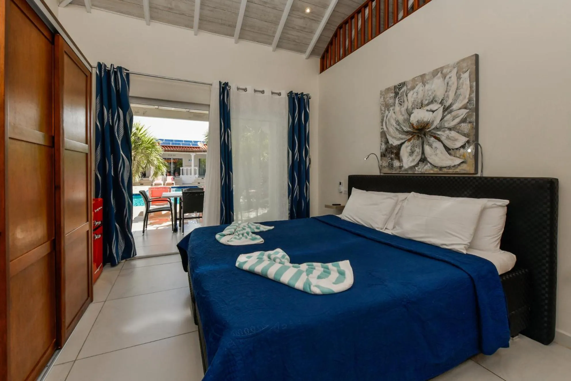 Bed in Boutique Hotel Swiss Paradise Aruba Villas and Suites