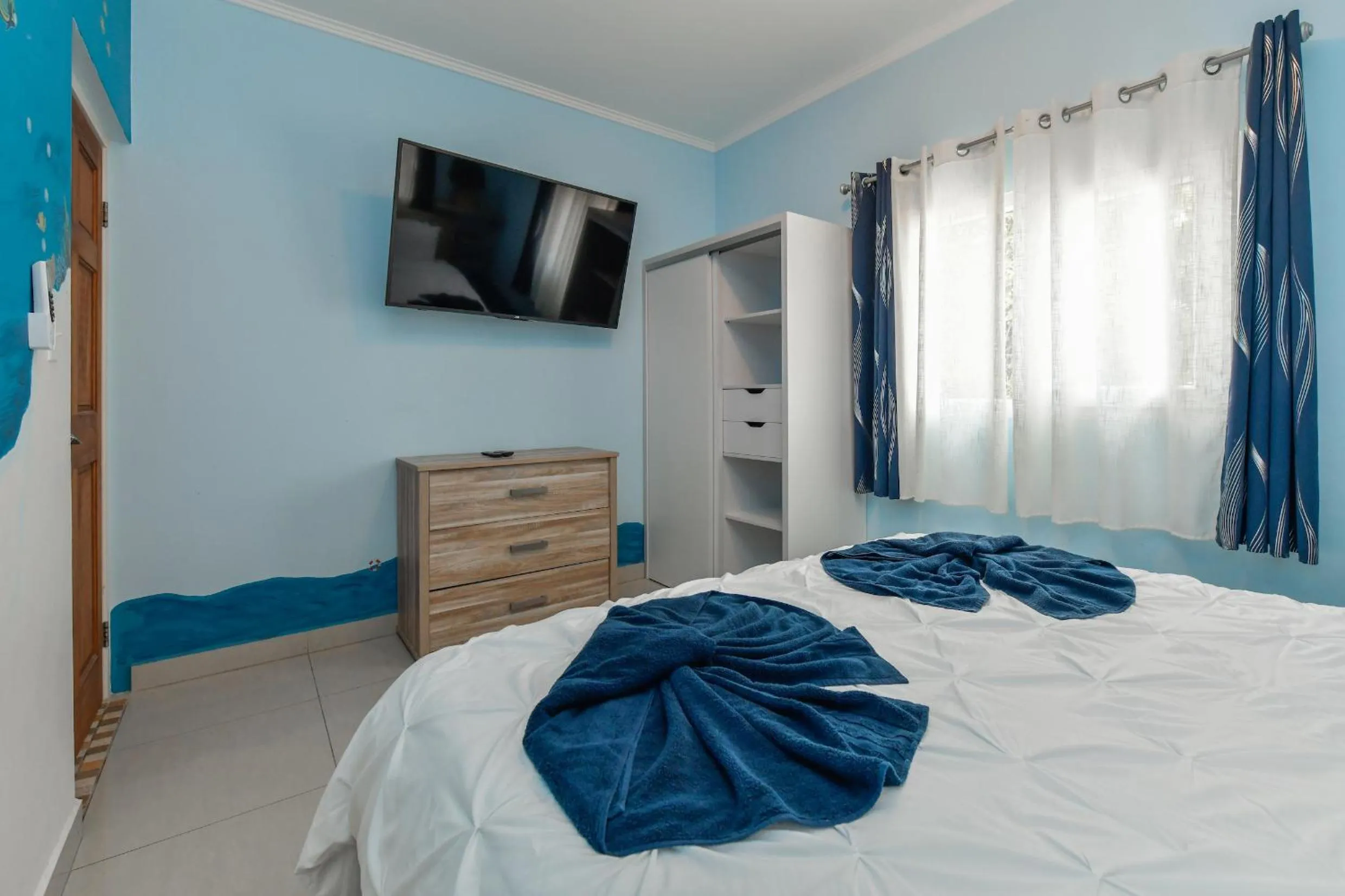 Bed in Boutique Hotel Swiss Paradise Aruba Villas and Suites