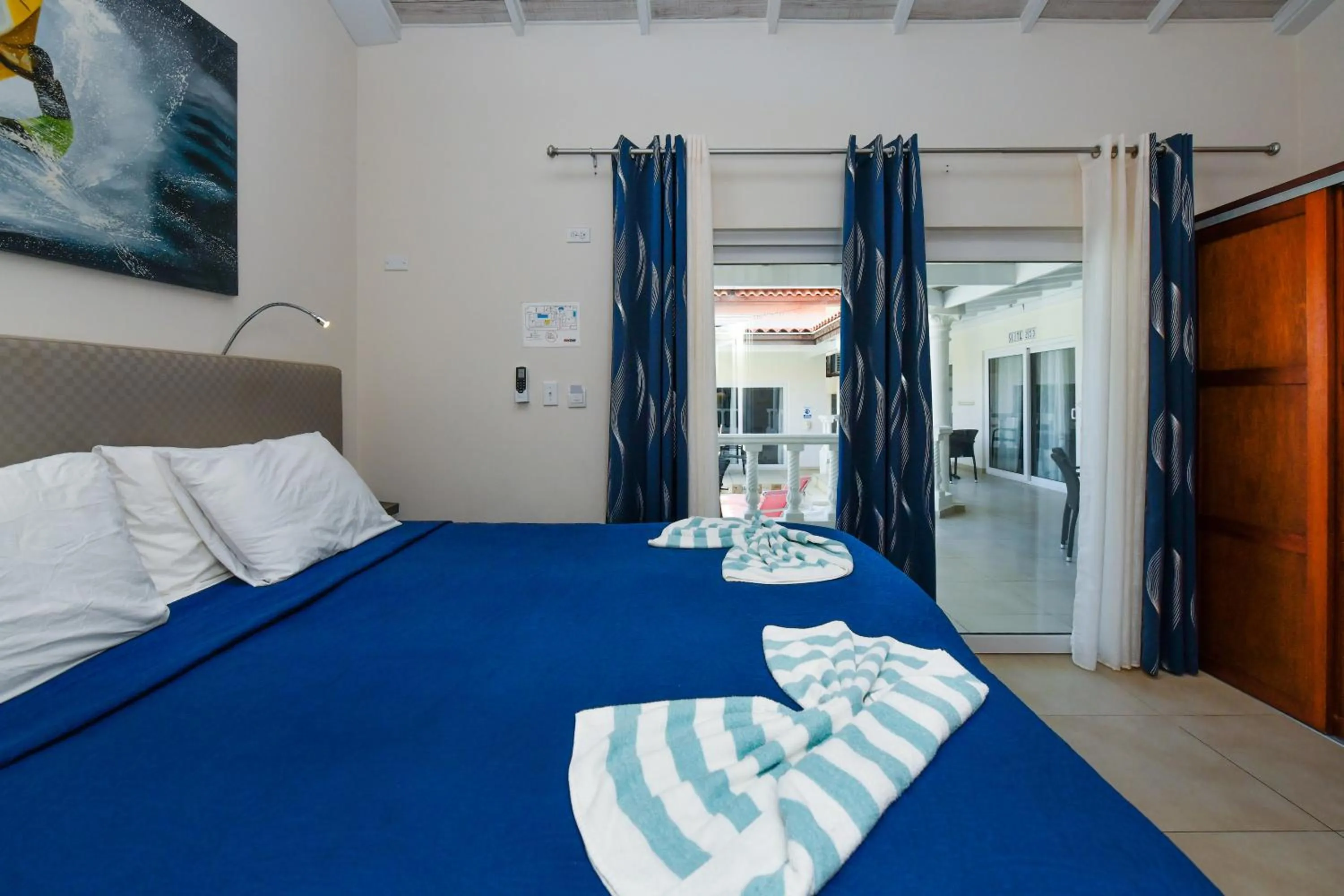 Bed in Boutique Hotel Swiss Paradise Aruba Villas and Suites