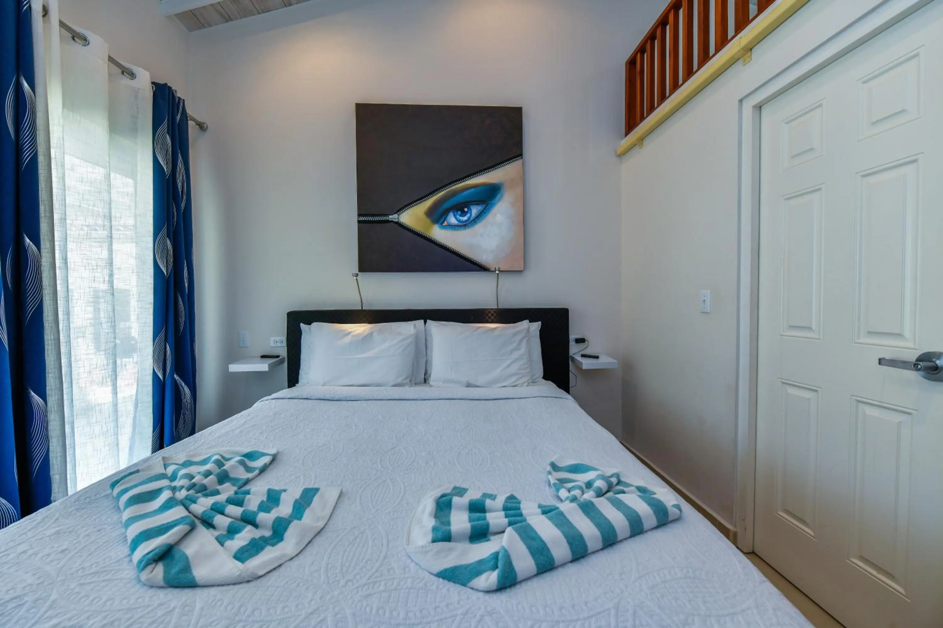 Bed in Boutique Hotel Swiss Paradise Aruba Villas and Suites