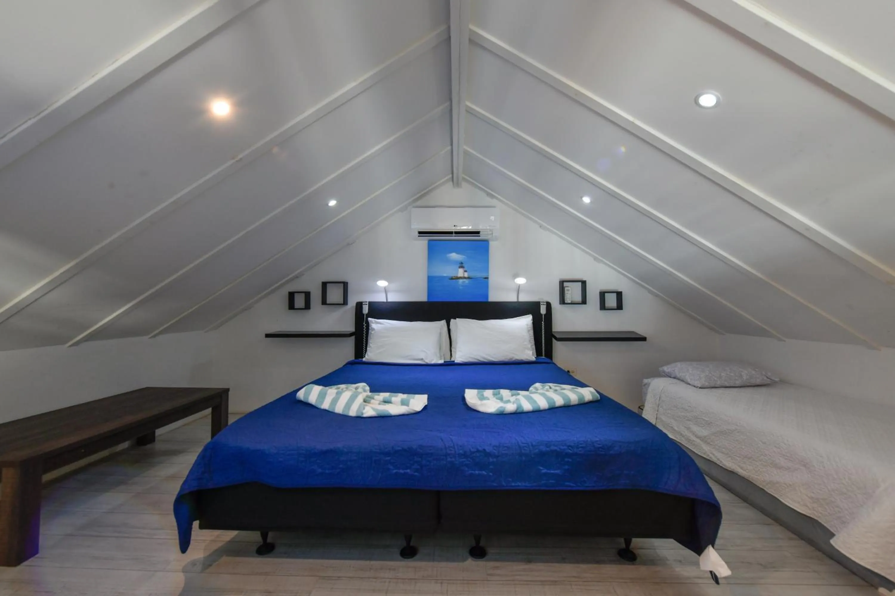 Bed in Boutique Hotel Swiss Paradise Aruba Villas and Suites