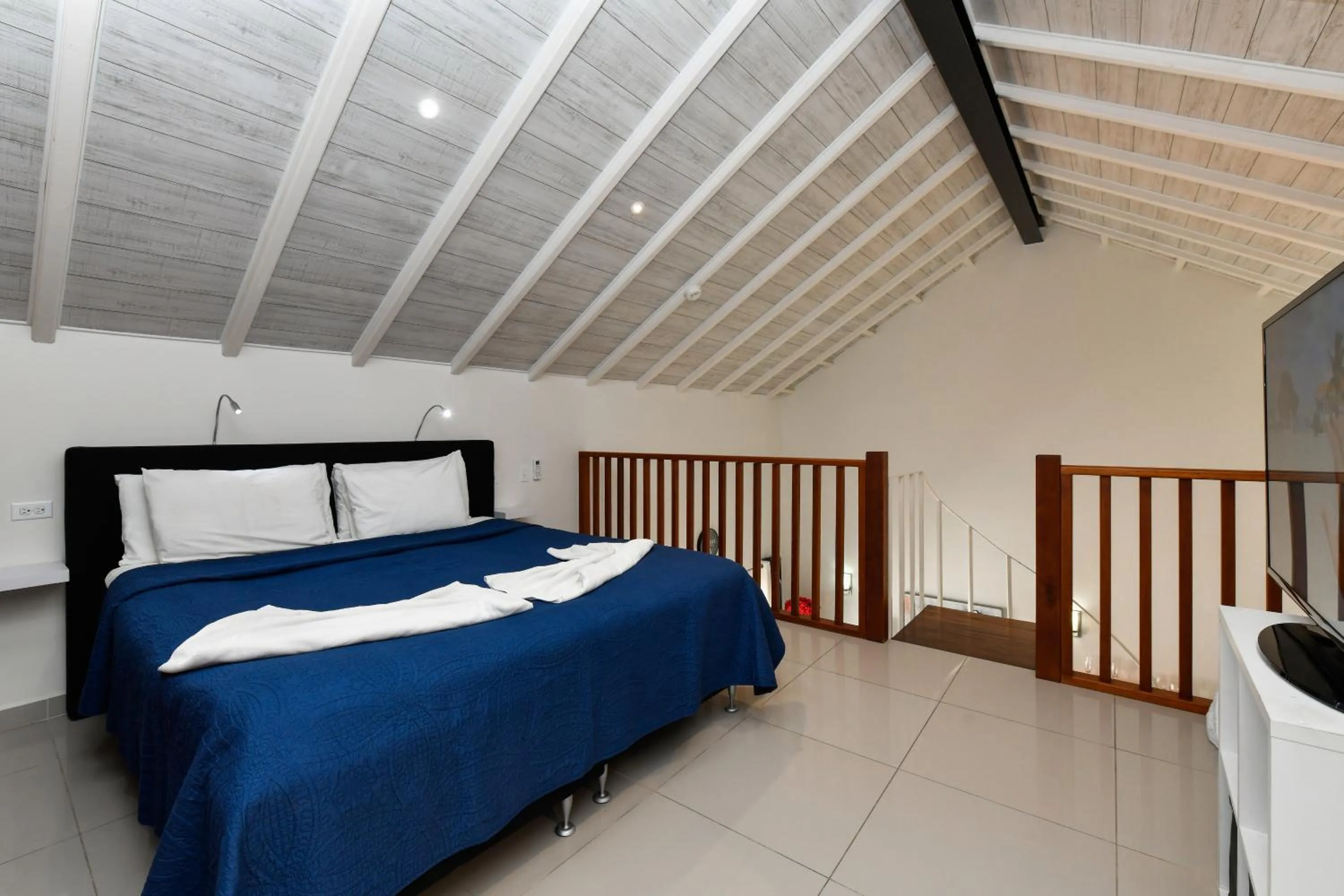 Bed in Boutique Hotel Swiss Paradise Aruba Villas and Suites