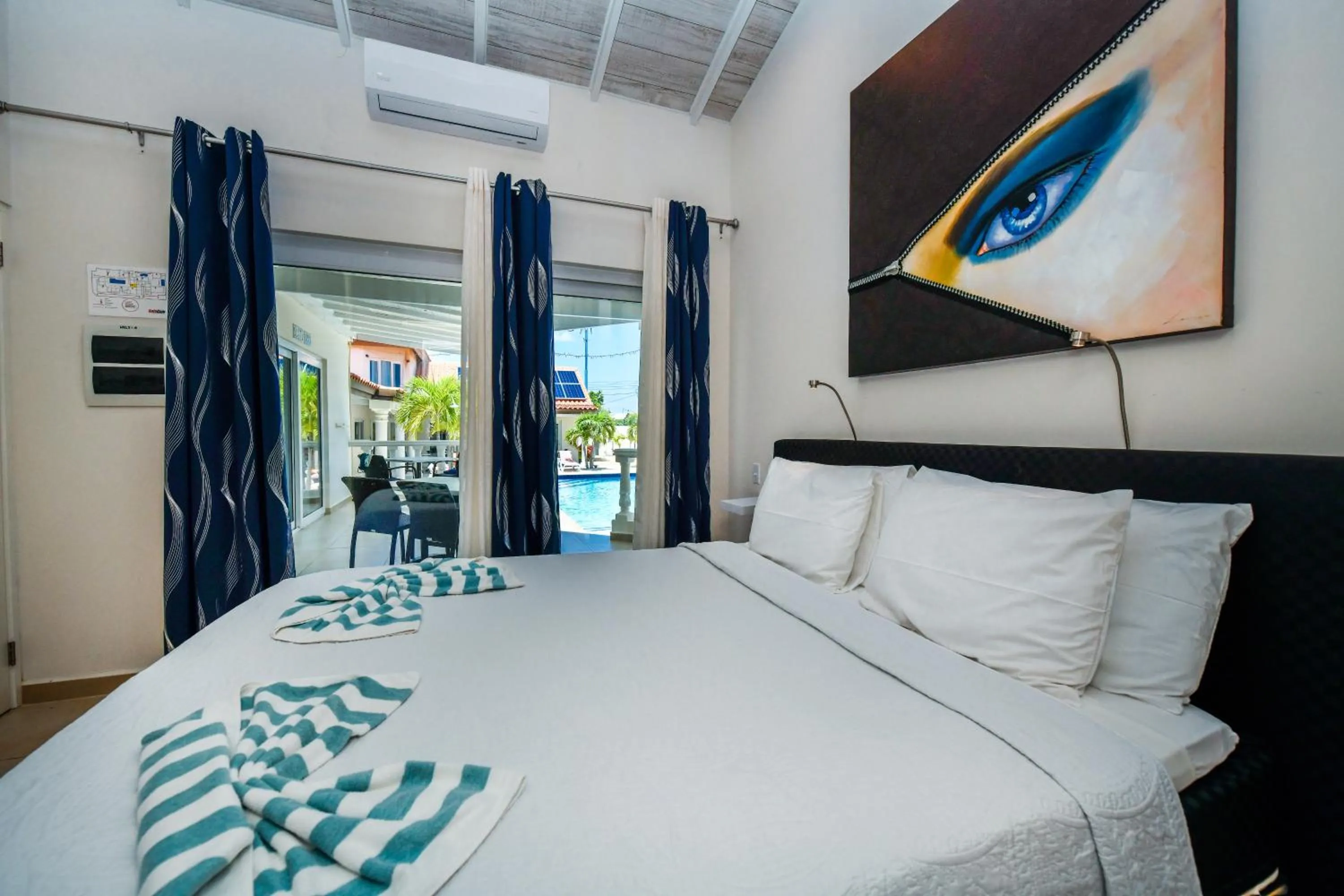 Bed in Boutique Hotel Swiss Paradise Aruba Villas and Suites