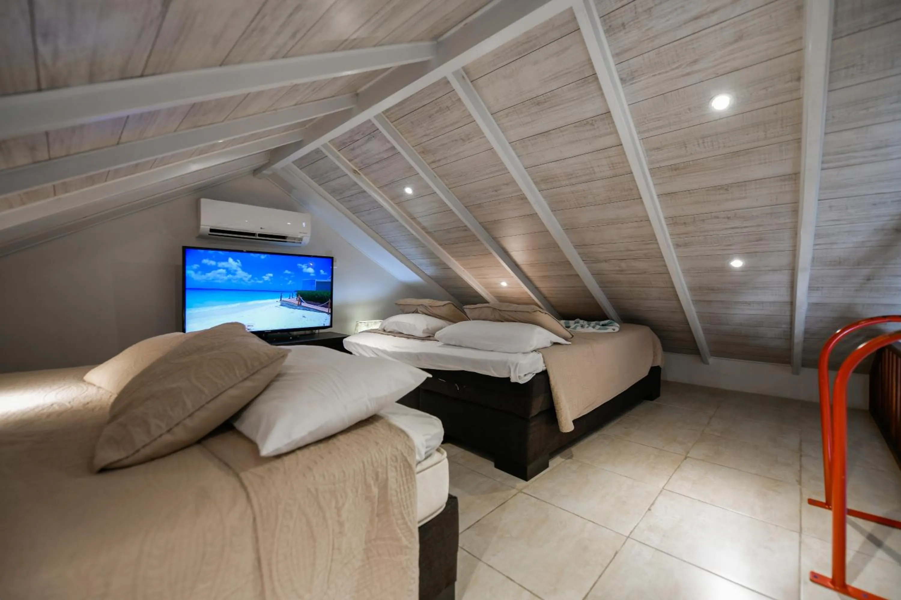 Bed in Boutique Hotel Swiss Paradise Aruba Villas and Suites