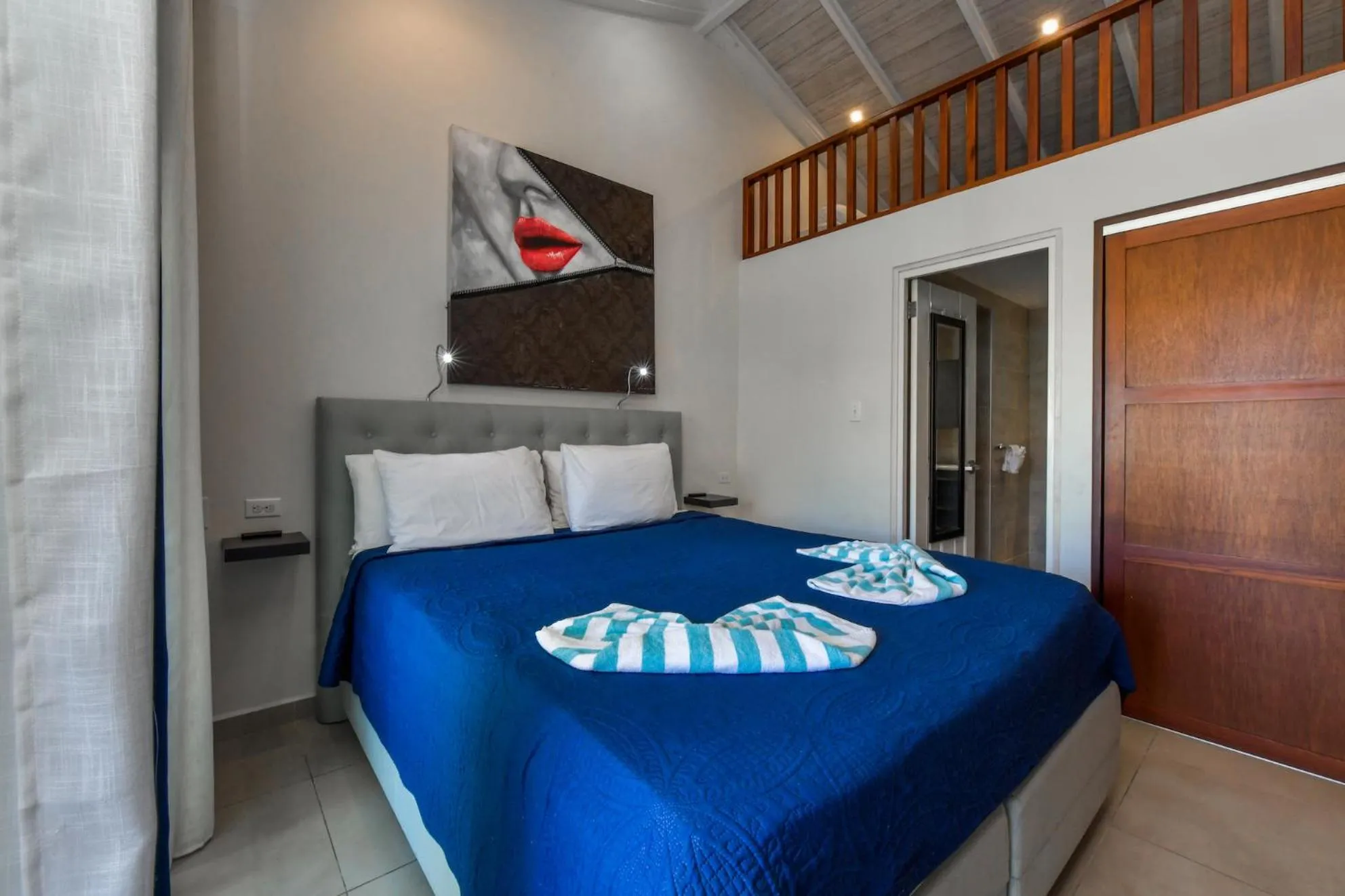 Bed in Boutique Hotel Swiss Paradise Aruba Villas and Suites