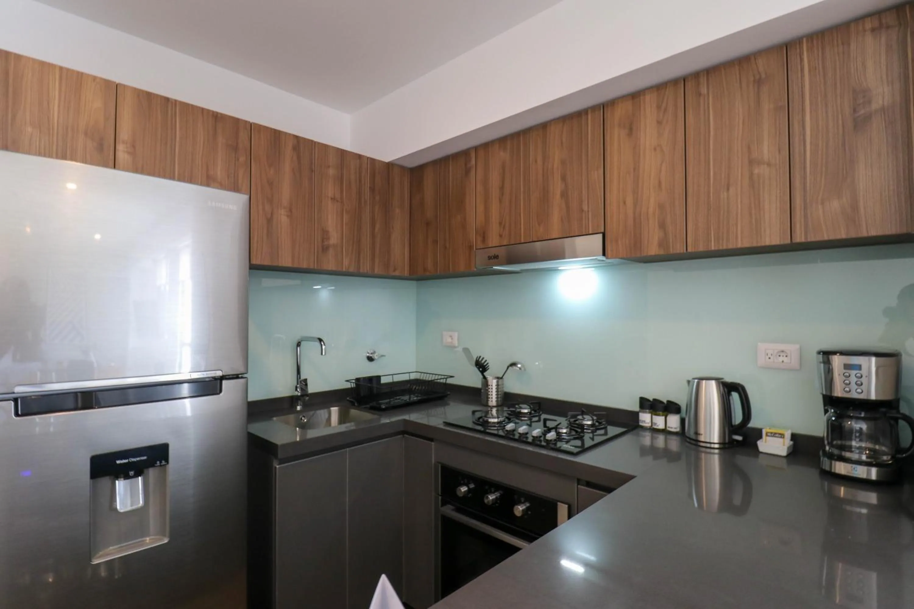 Kitchen or kitchenette in Gray by Wynwood House