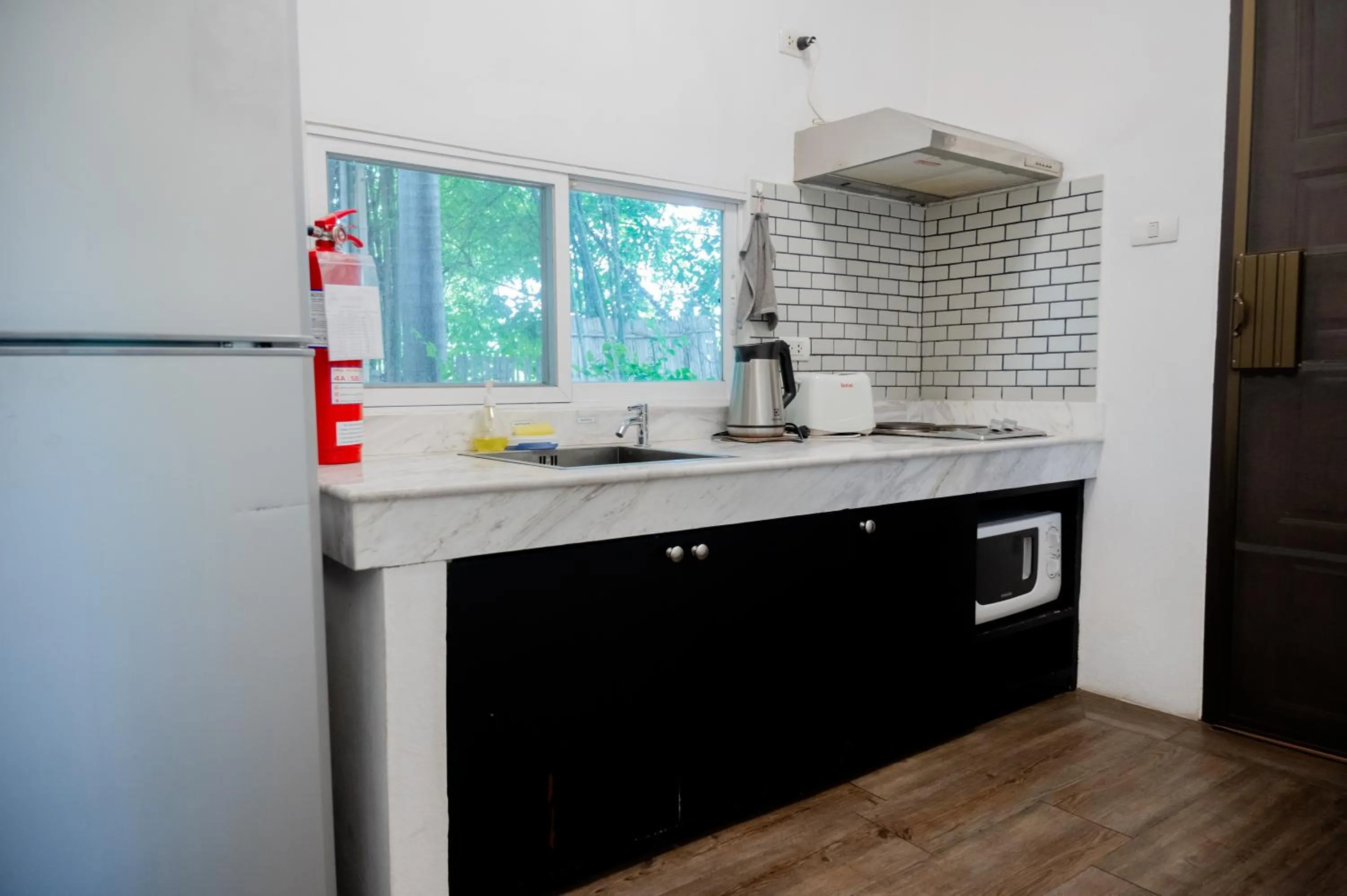 Kitchen or kitchenette in Tolani Southgate Villa Chiang Mai