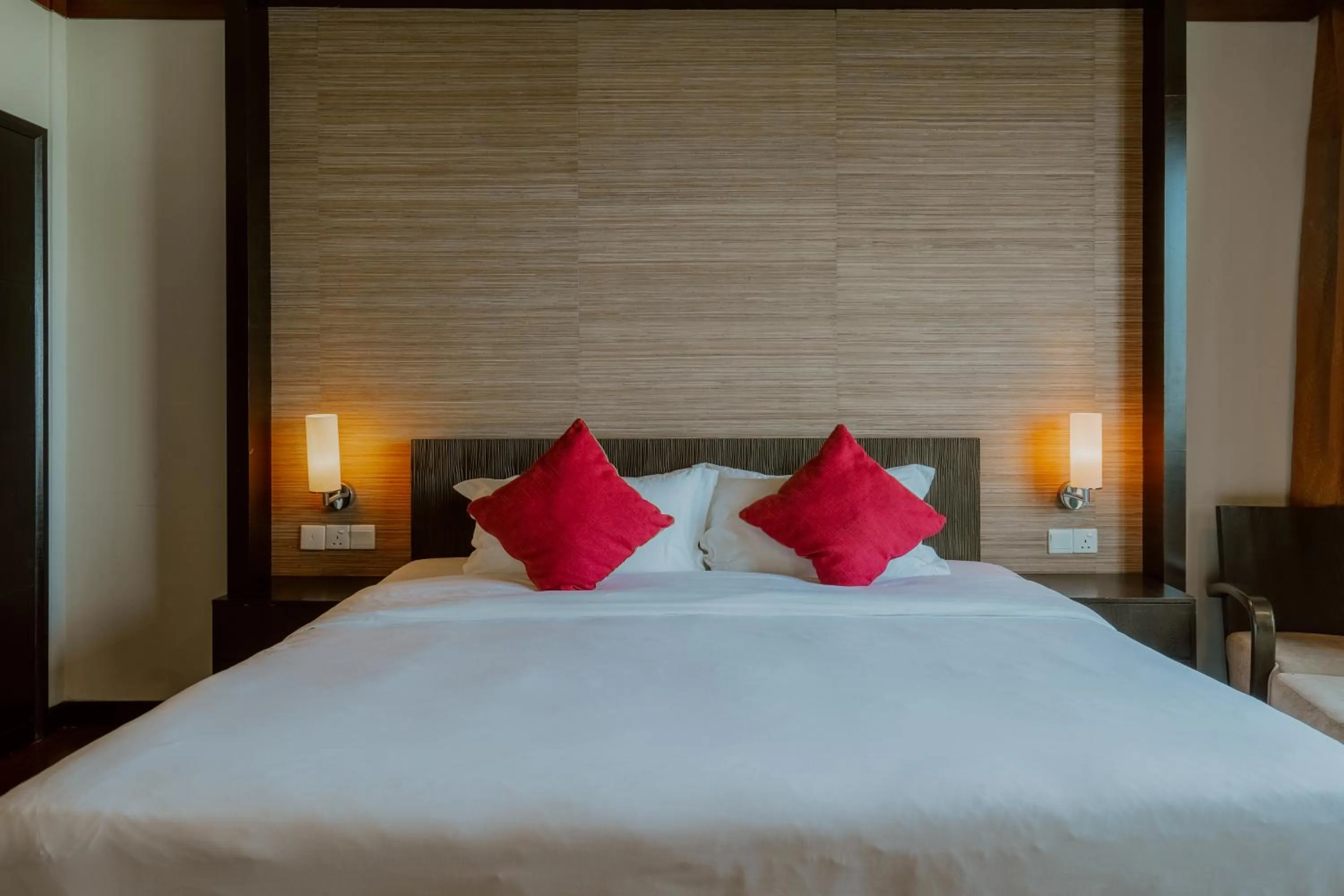 Bed in Borneo Beach Villa & Suite