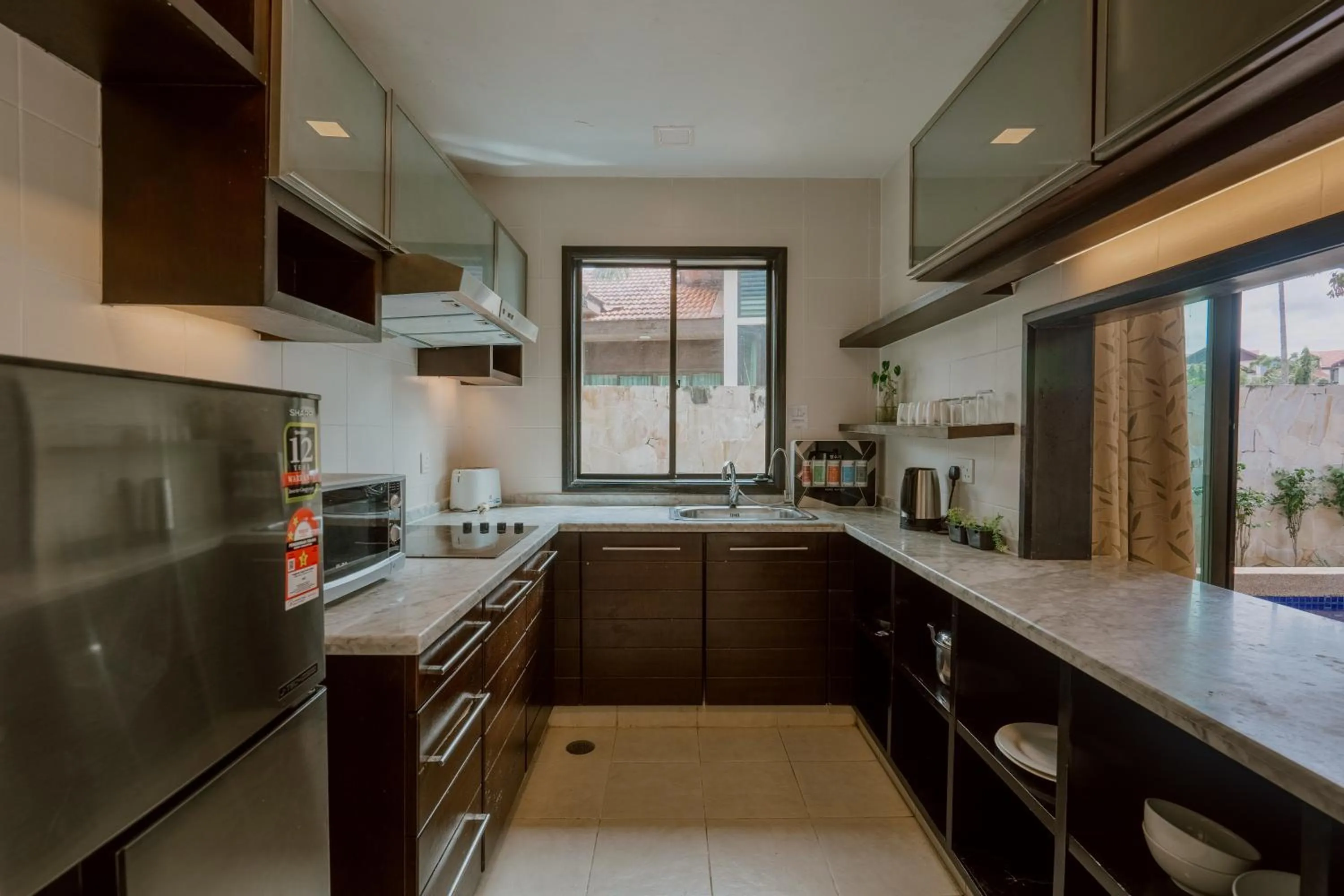 Kitchen or kitchenette in Borneo Beach Villa & Suite