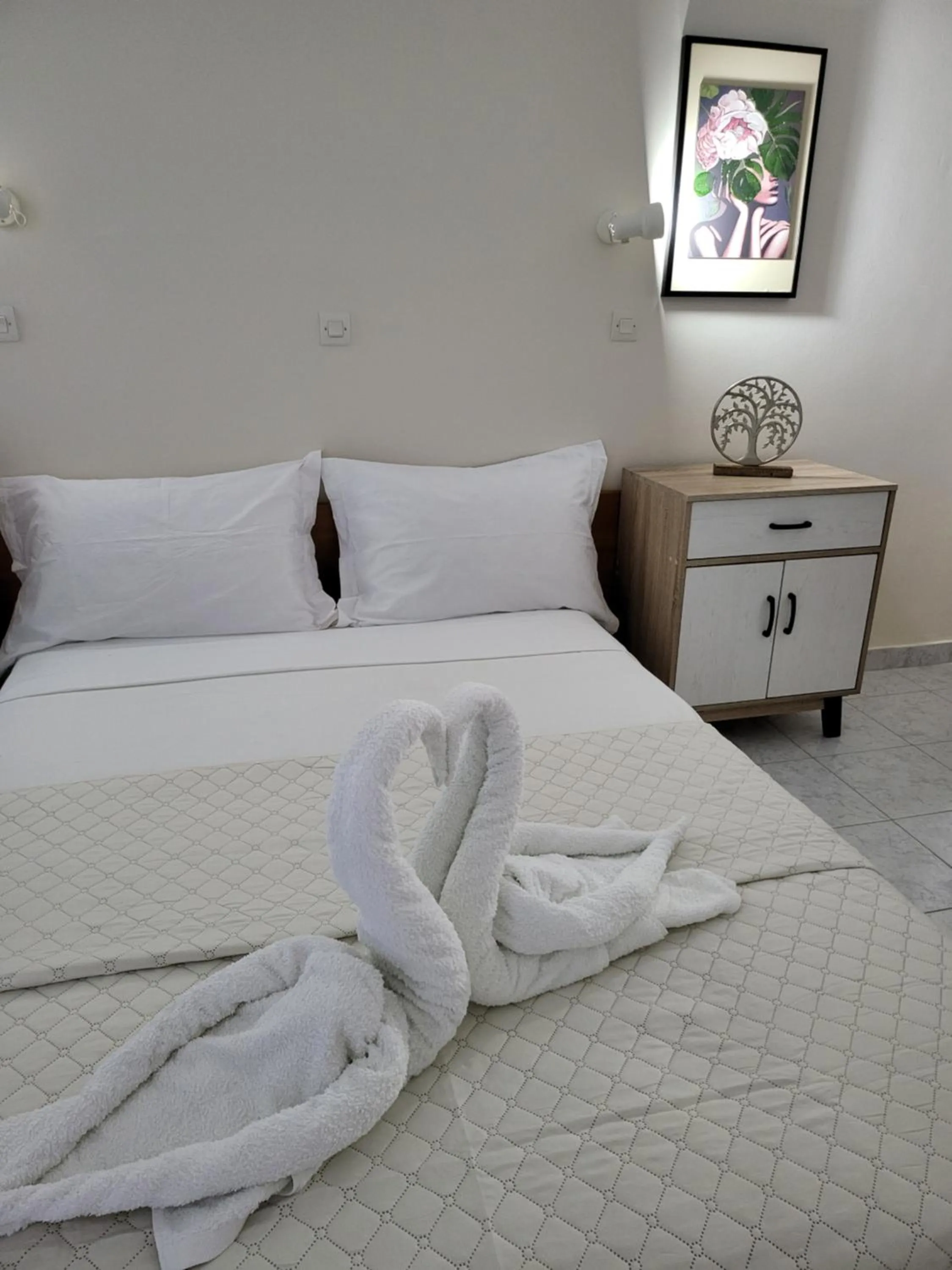 Bed in Pyrgos Hotel Apartments
