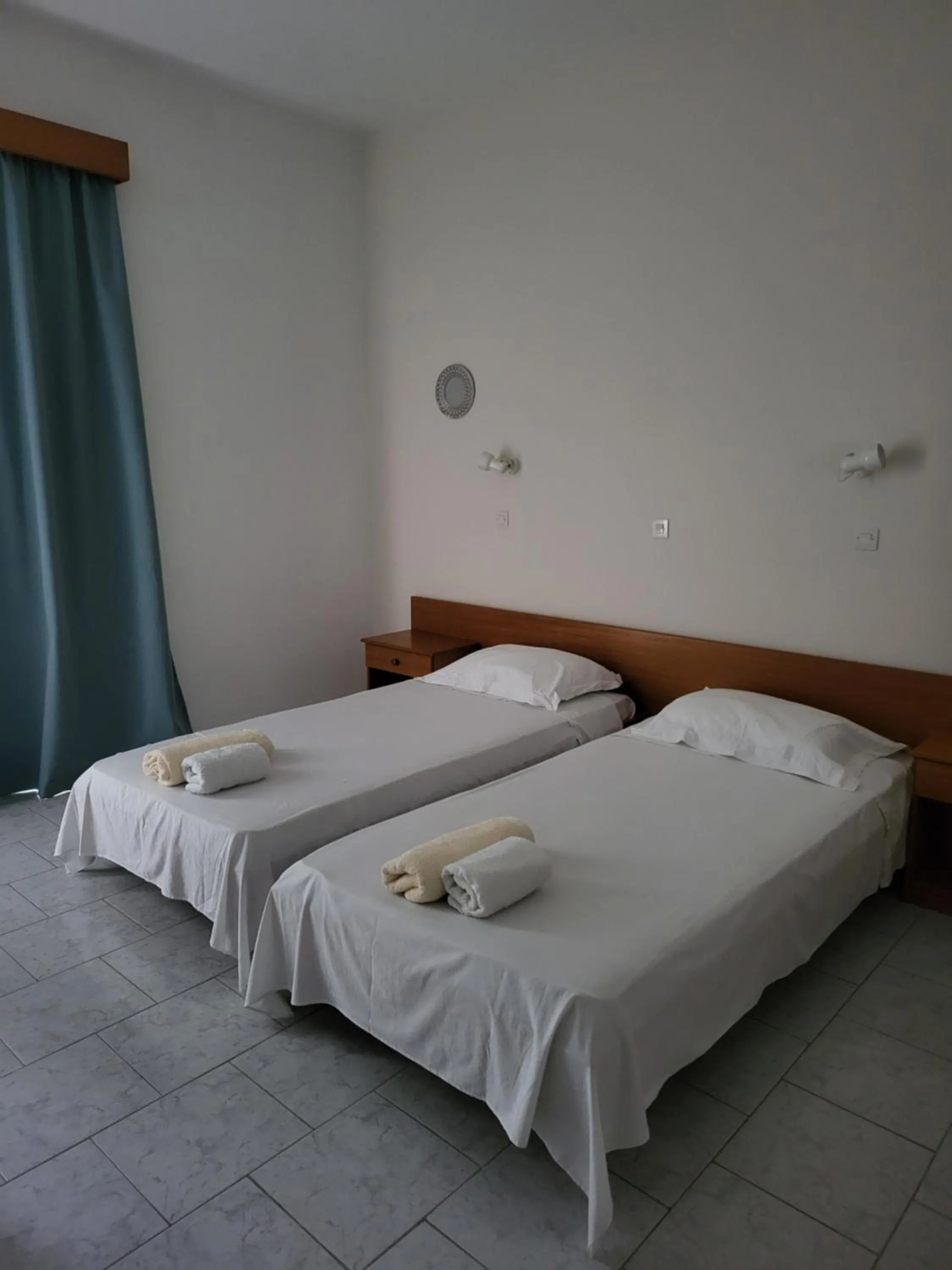 Bed in Pyrgos Hotel Apartments