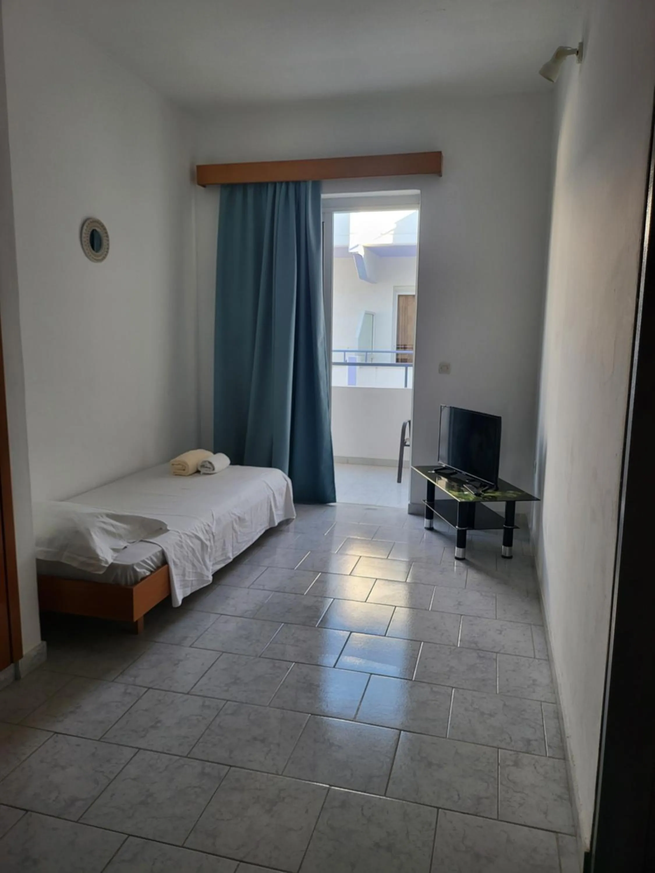 Bed in Pyrgos Hotel Apartments