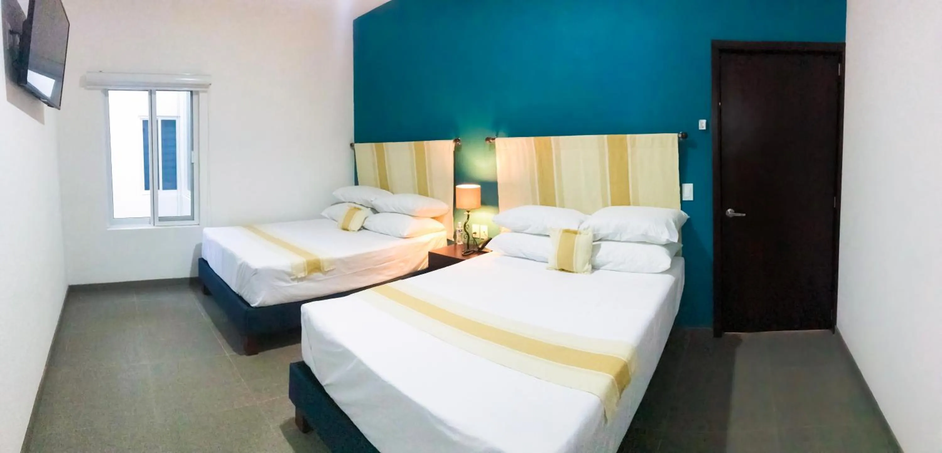 Bed in Nueve Agaves Hotel