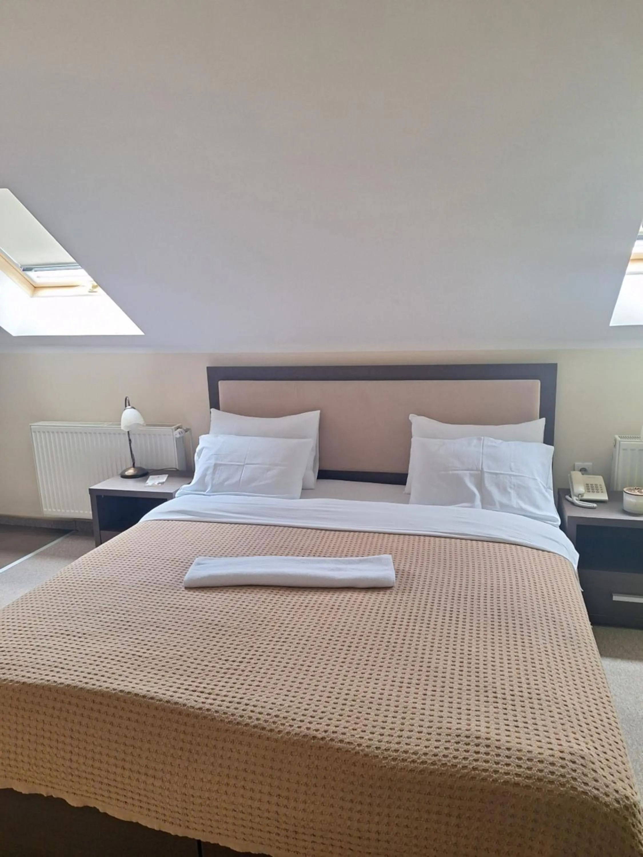 Bed in Garni Hotel Ema