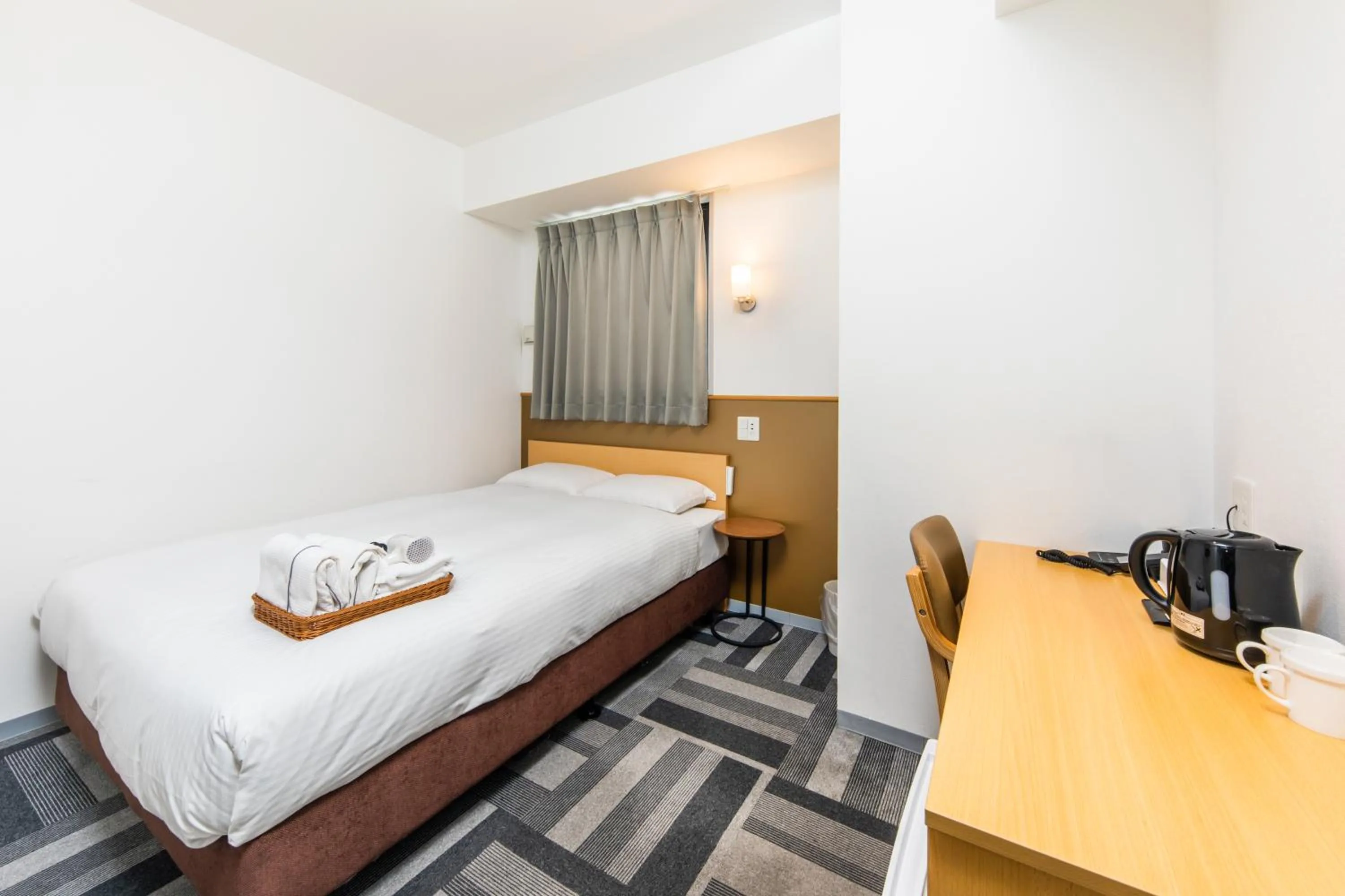 Bed in HOTEL NEXUS Hakata Sanno