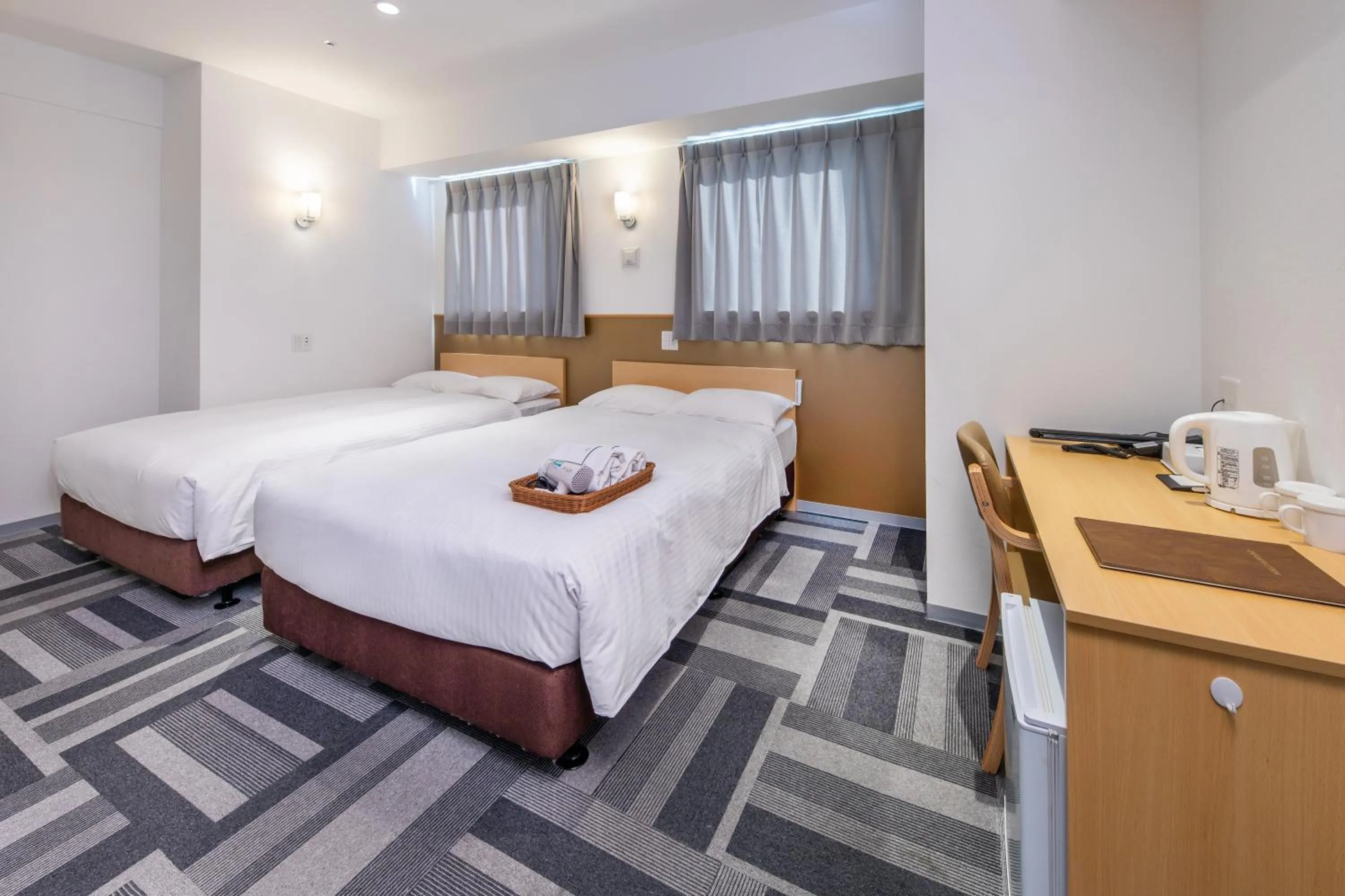 Bed in HOTEL NEXUS Hakata Sanno