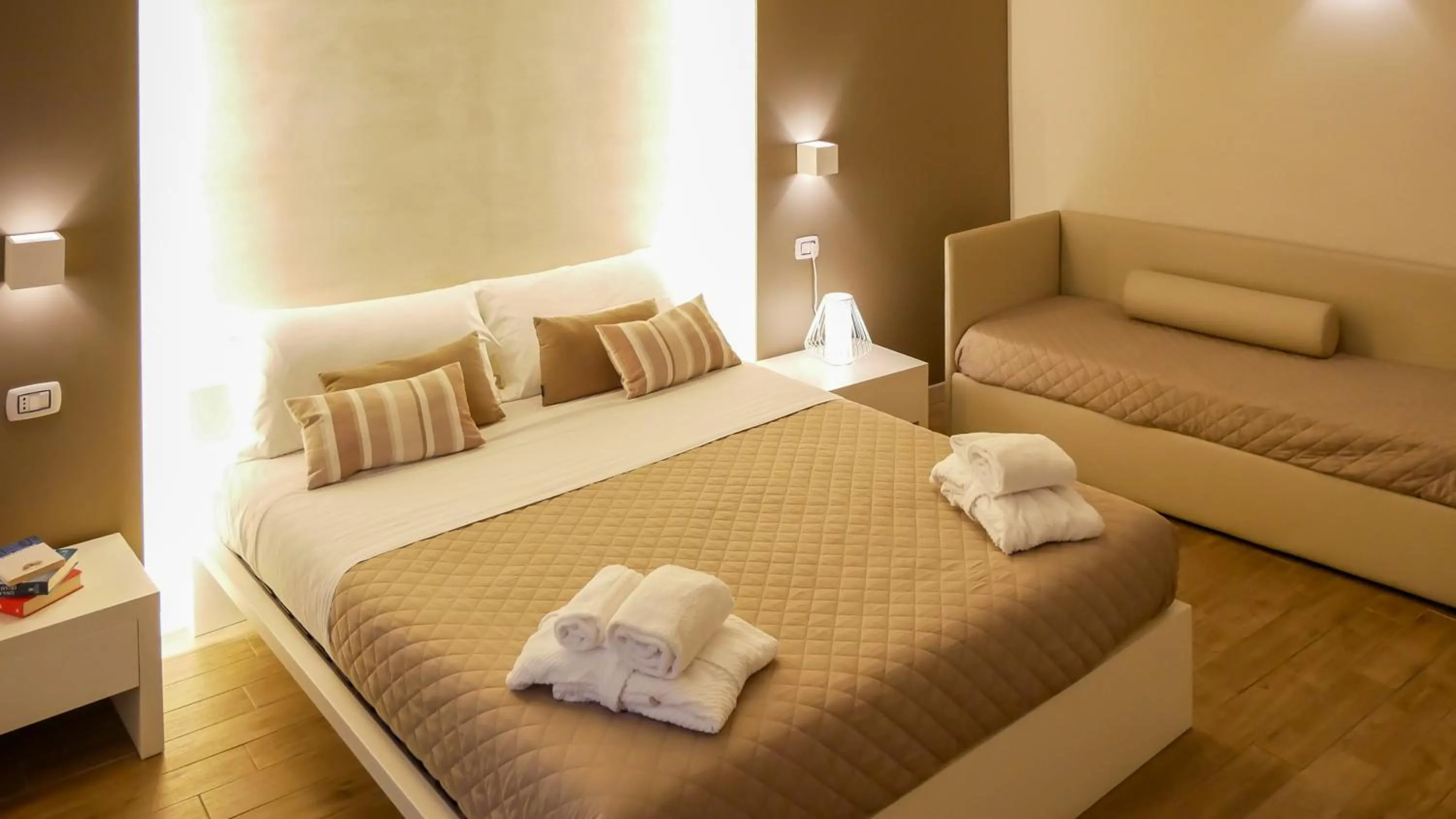 Bed in La Banchina Holiday Rooms